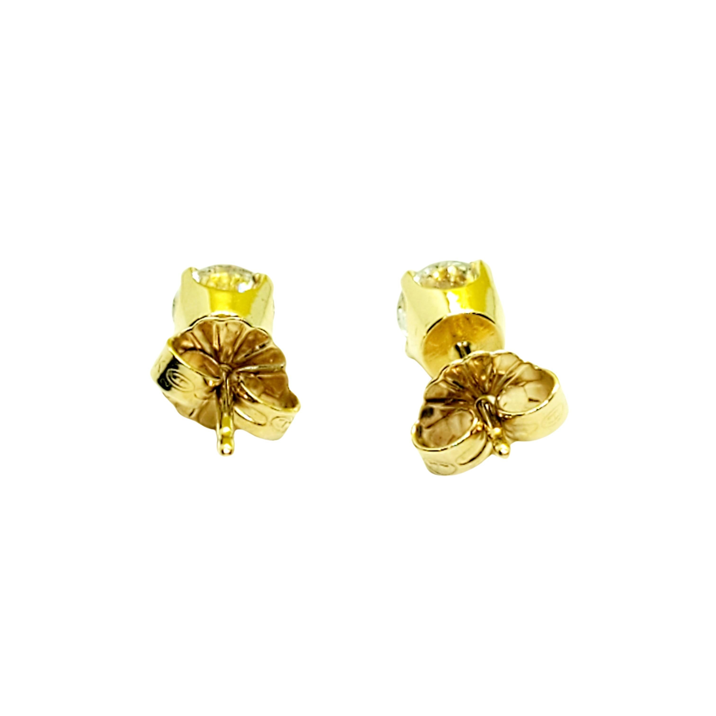 Women's 14 Karat Yellow Gold Diamond Stud Earrings .73 Carat For Sale
