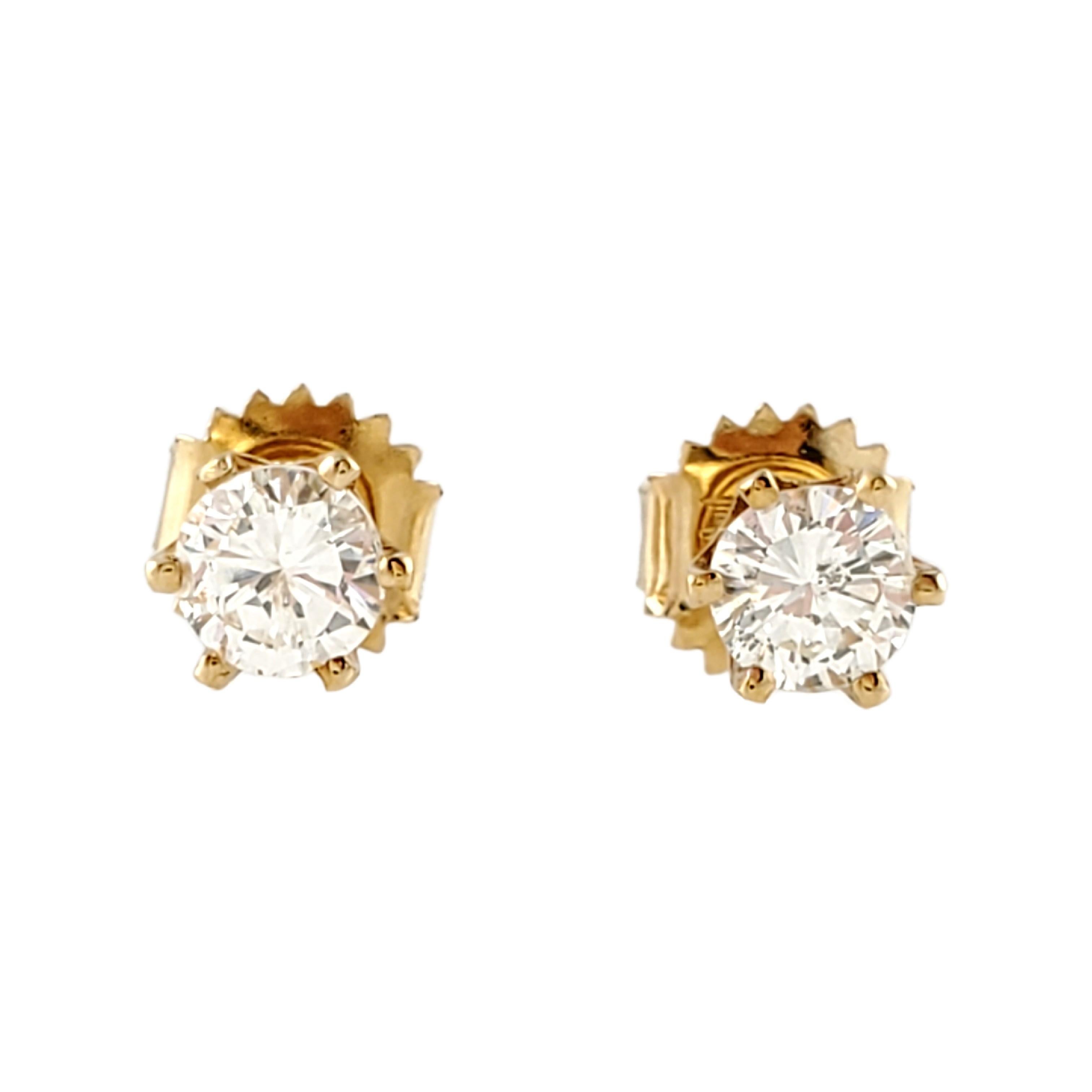 Vintage 14 Karat Yellow Gold Diamond Stud Earrings .80 ct. 
These classic sparkling stud earrings each feature one round brilliant cut diamond (.40 ct.) set in a yellow gold six-prong setting. Screw back closures. 
Approximate total diamond weight: