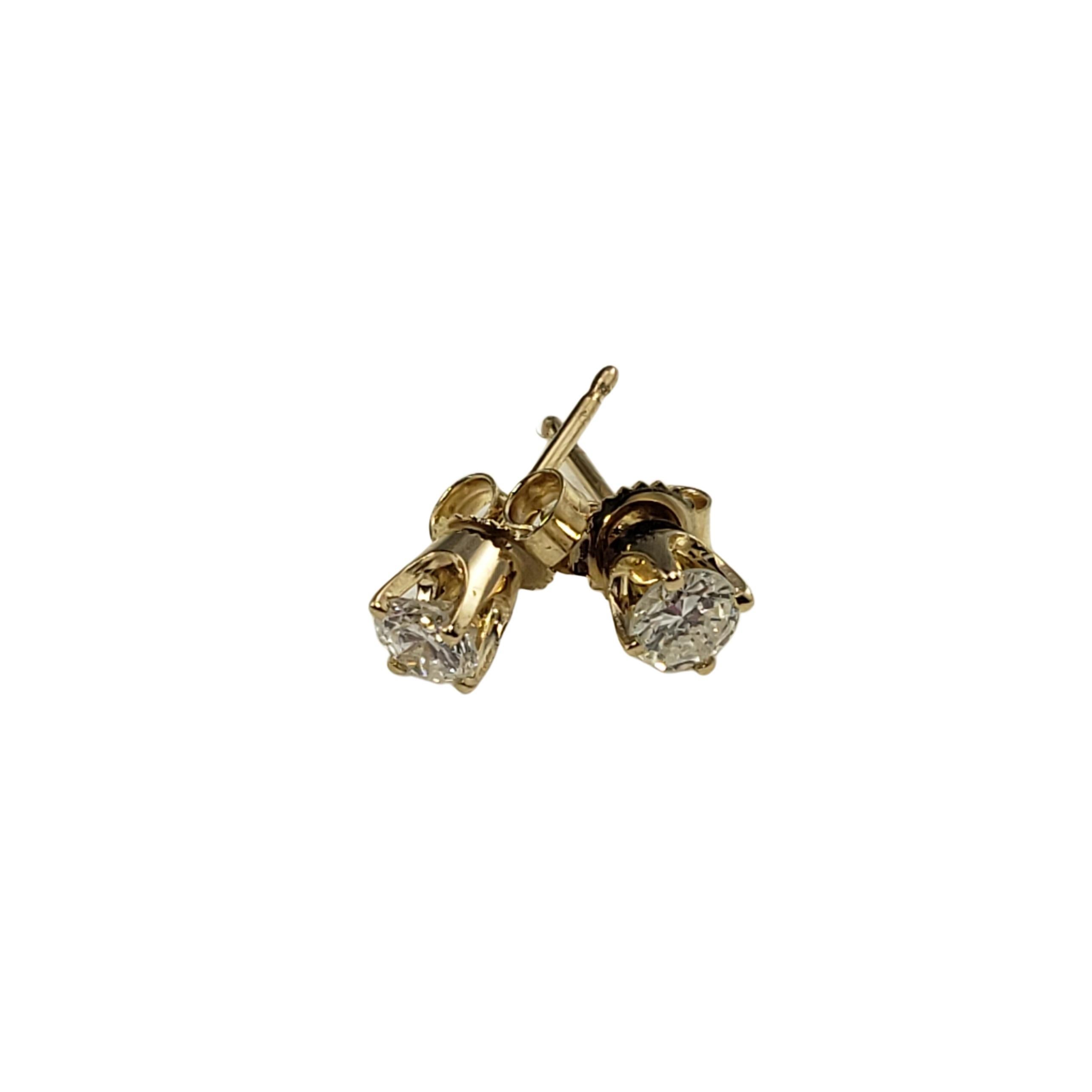 14 Karat Yellow Gold Diamond Stud Earrings-

These sparkling stud earrings each feature one round brilliant cut diamond set in classic 14K yellow gold.  Push back closures.

Approximate total diamond weight:   .40 ct.

Diamond color: H-I

Diamond