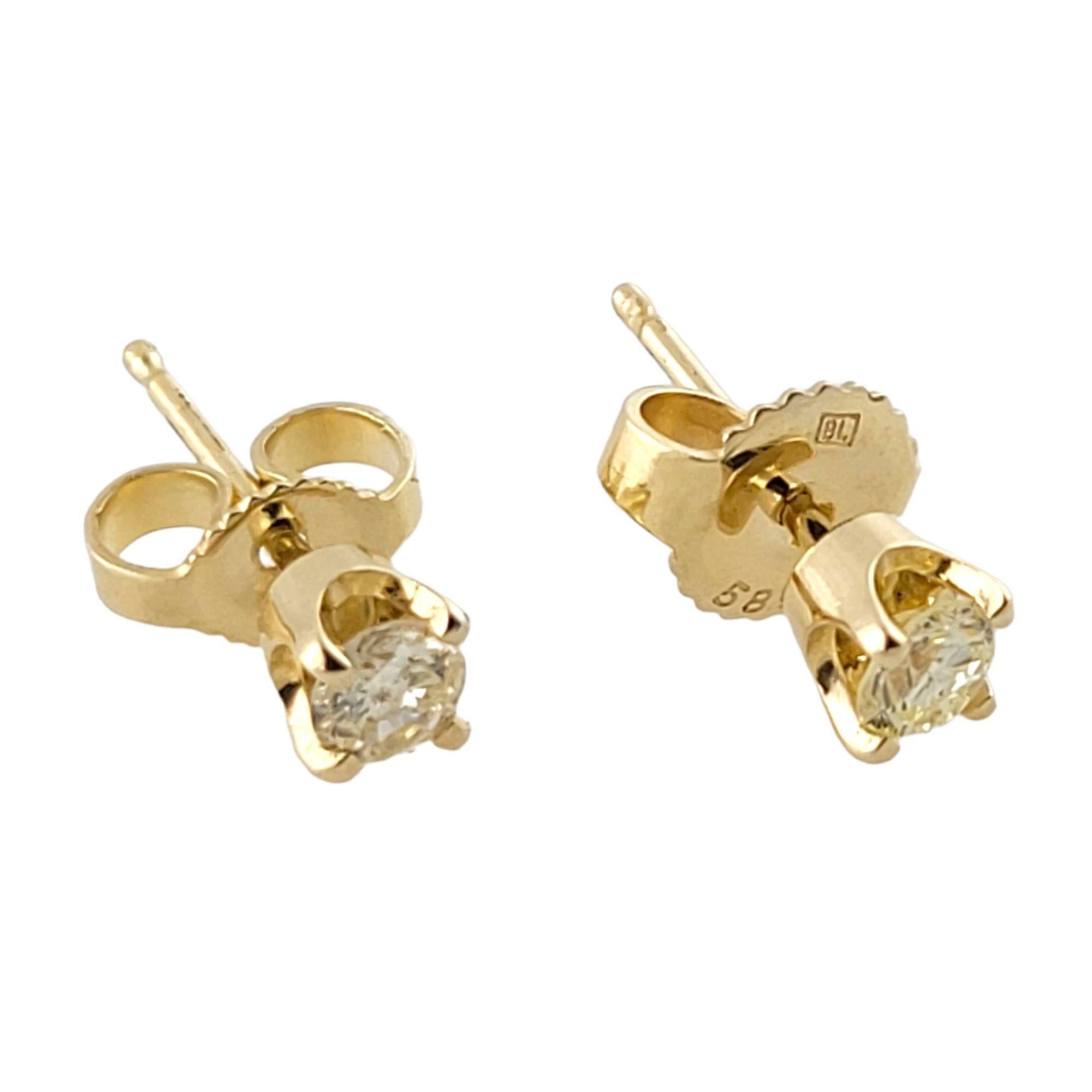 Vintage 14 Karat Yellow Gold Diamond Stud Earrings-

These sparkling stud earrings each feature one round brilliant cut diamond set in 14K yellow gold. Screw back closures.

Approximate total diamond weight: .29 ct.

Diamond clarity: I1

Diamond