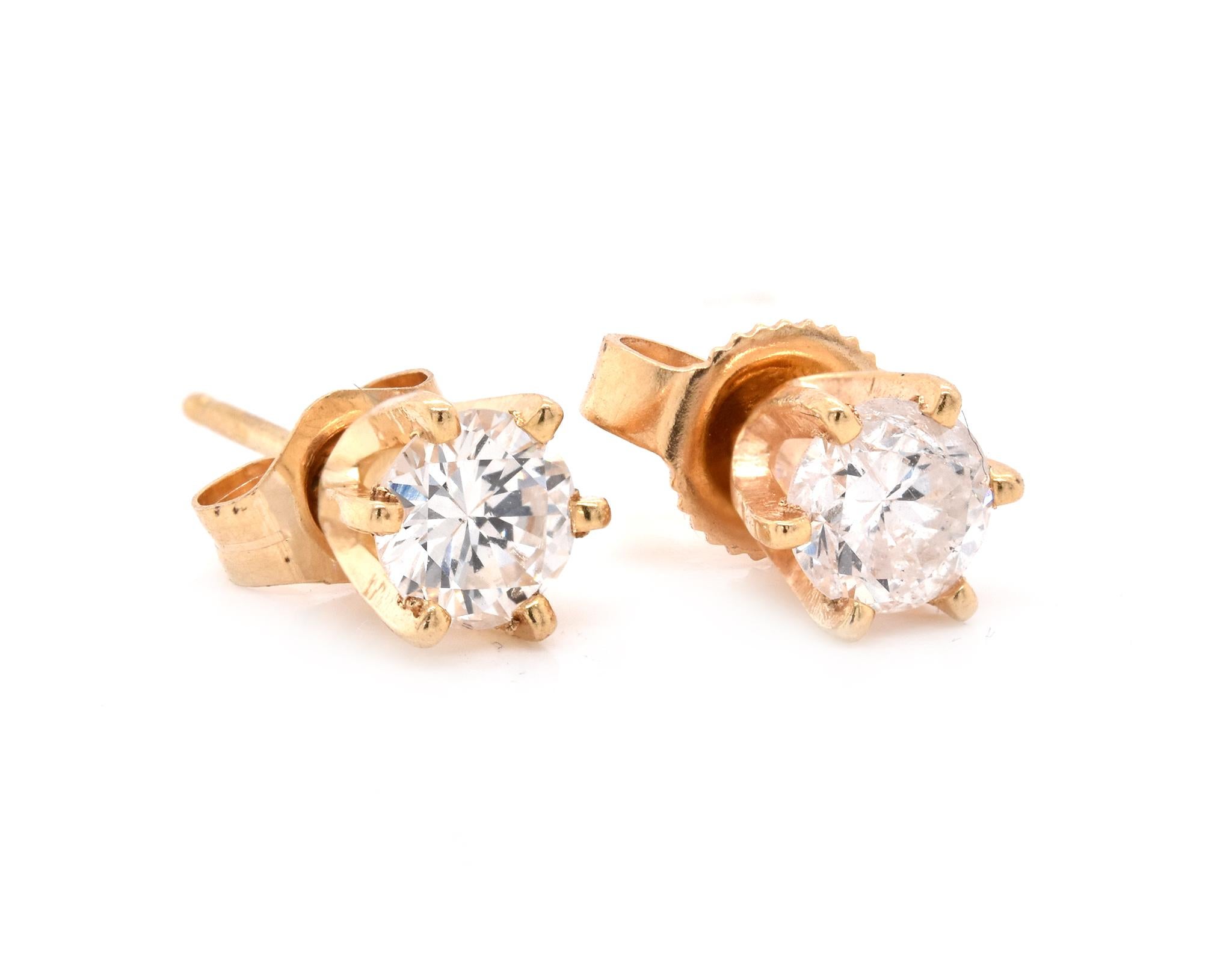 Material: 14k yellow gold
Diamond: 2 round brilliant cut = .60cttw
Color: G
Clarity: SI2
Dimensions: earrings measure approximately 4.87mm in diameter
Fastenings: post with friction backs
Weight:  1.06 grams