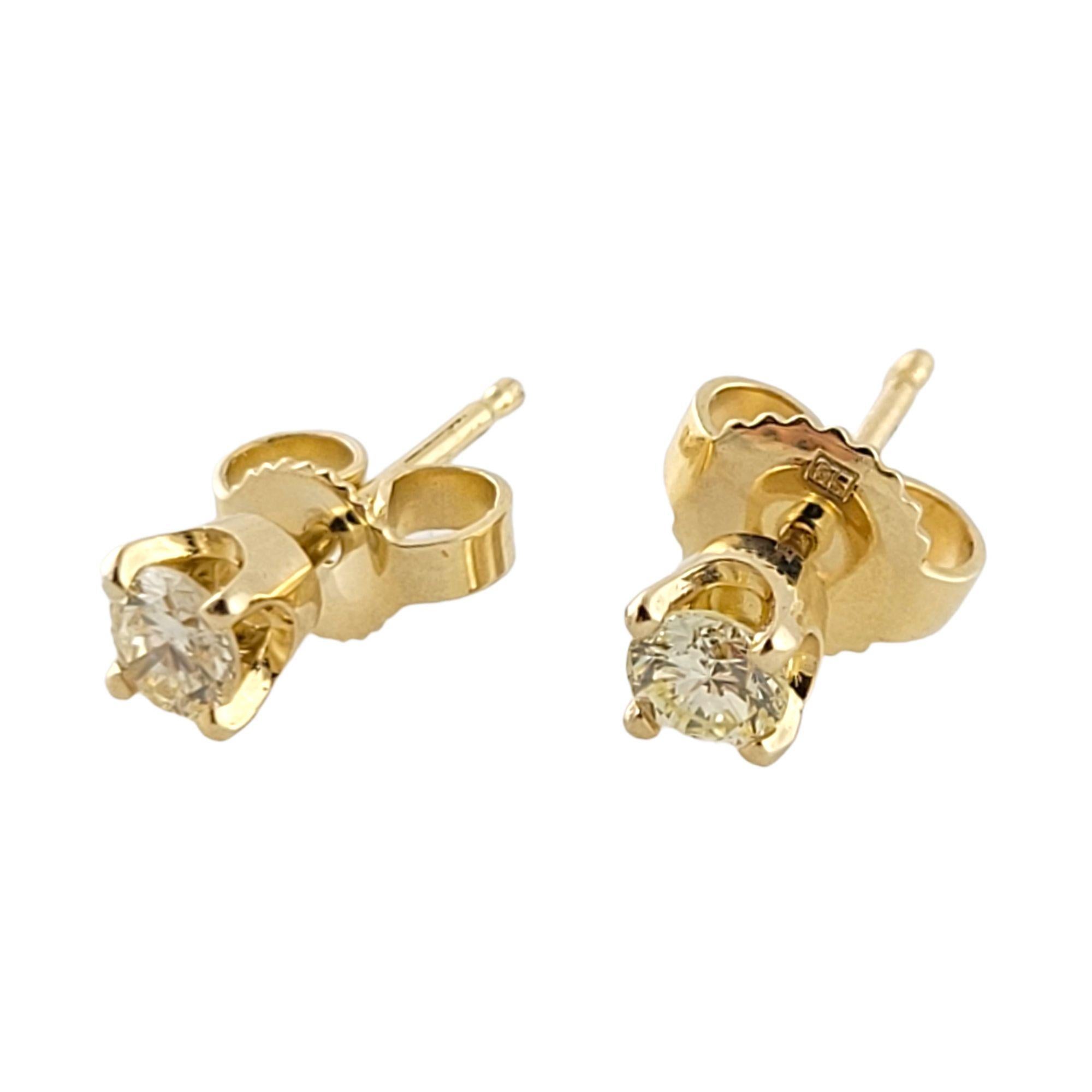 Round Cut 14 Karat Yellow Gold Diamond Stud Earrings For Sale