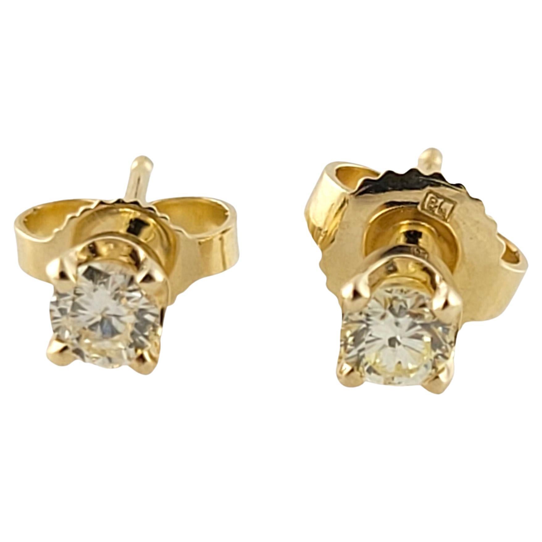 14 Karat Yellow Gold Diamond Stud Earrings For Sale