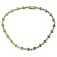  Bracelet tennis en or jaune 14 carats et diamants n° 15471