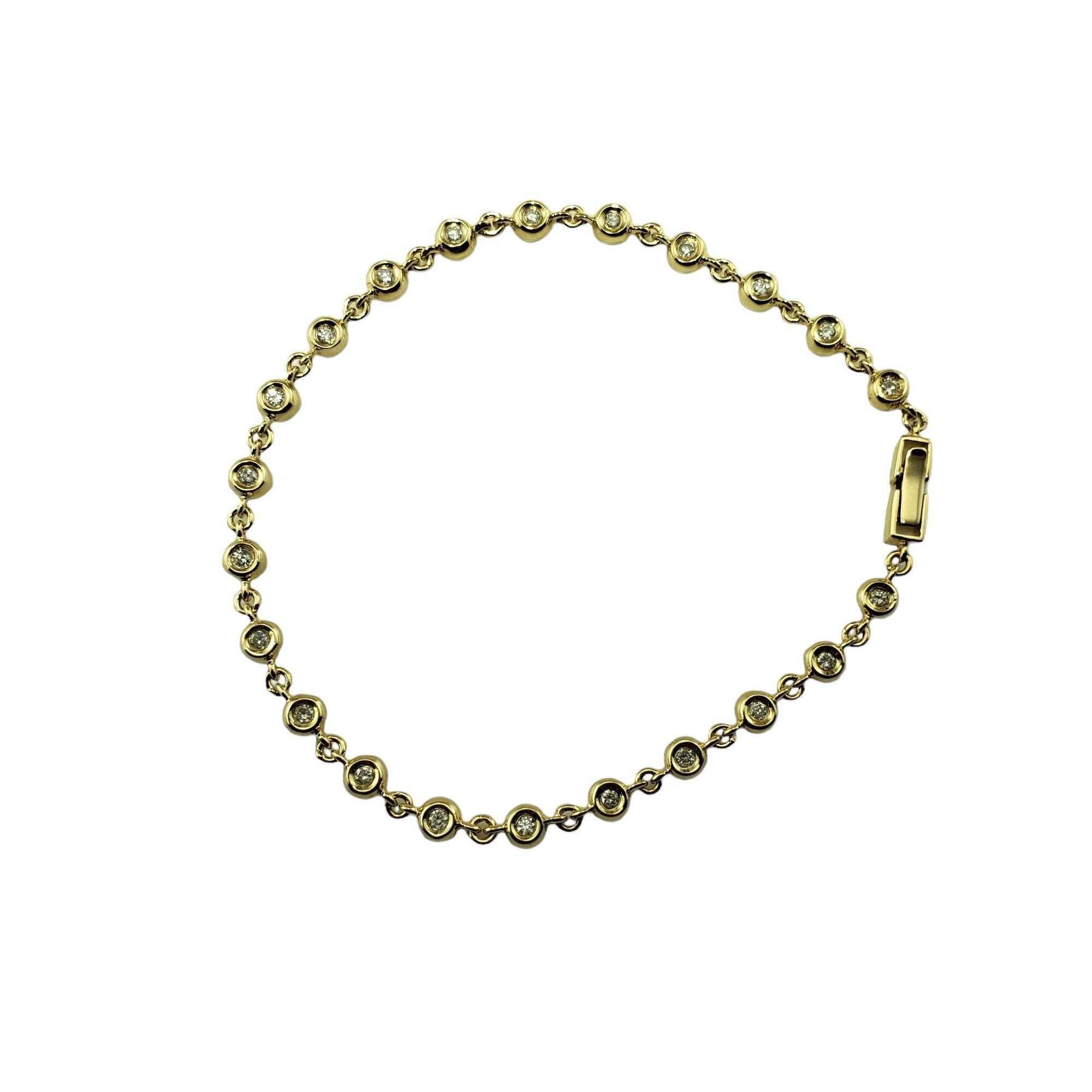 Vintage 14 Karat Yellow Gold Diamond Tennis Bracelet-

This sparkling tennis bracelet features 22 round brilliant cut diamonds set in classic 14K yellow gold.  Width:  4 mm.

Approximate total diamond weight:  .66 t.

Diamond clarity: I1-I2

Diamond