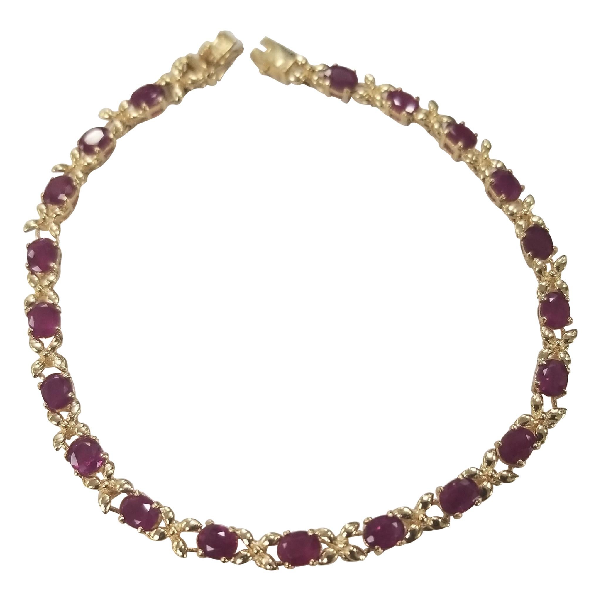 14 Karat Yellow Gold Ruby "Tennis" Bracelet, Containing 20 Oval Cut
