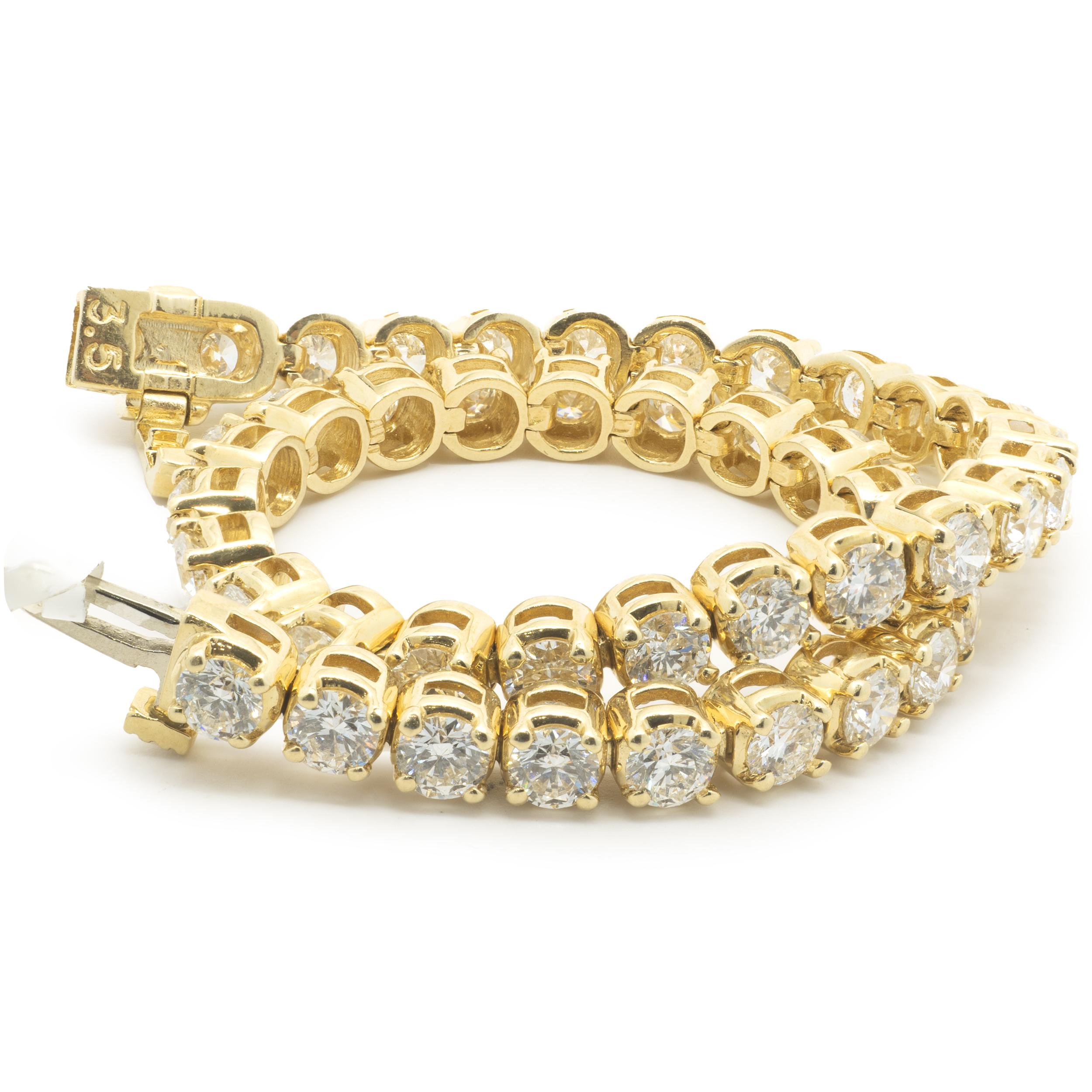Designer: custom
Material: 14K yellow gold
Diamonds: 52 round brilliant cut = 7.00cttw
Color: H
Clarity: SI1
Dimensions: bracelet will fit up to an 7-inch wrist
Weight: 14.81 grams
