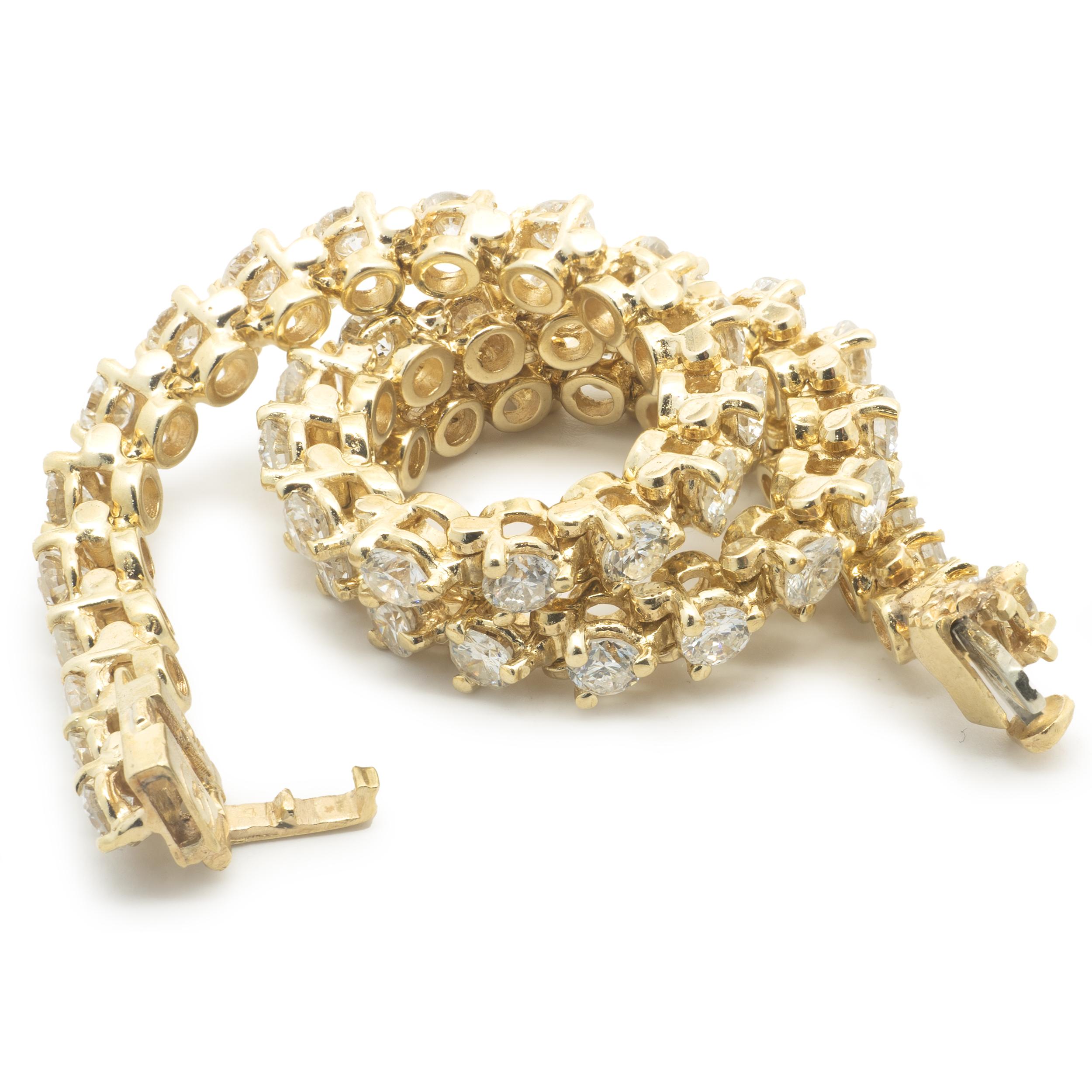 Designer: custom
Material: 14K yellow gold
Diamonds: 48 round brilliant cut = 3.36cttw
Color: H
Clarity: SI1-2
Dimensions: bracelet will fit up to an 7-inch wrist
Weight: 11.20 grams
