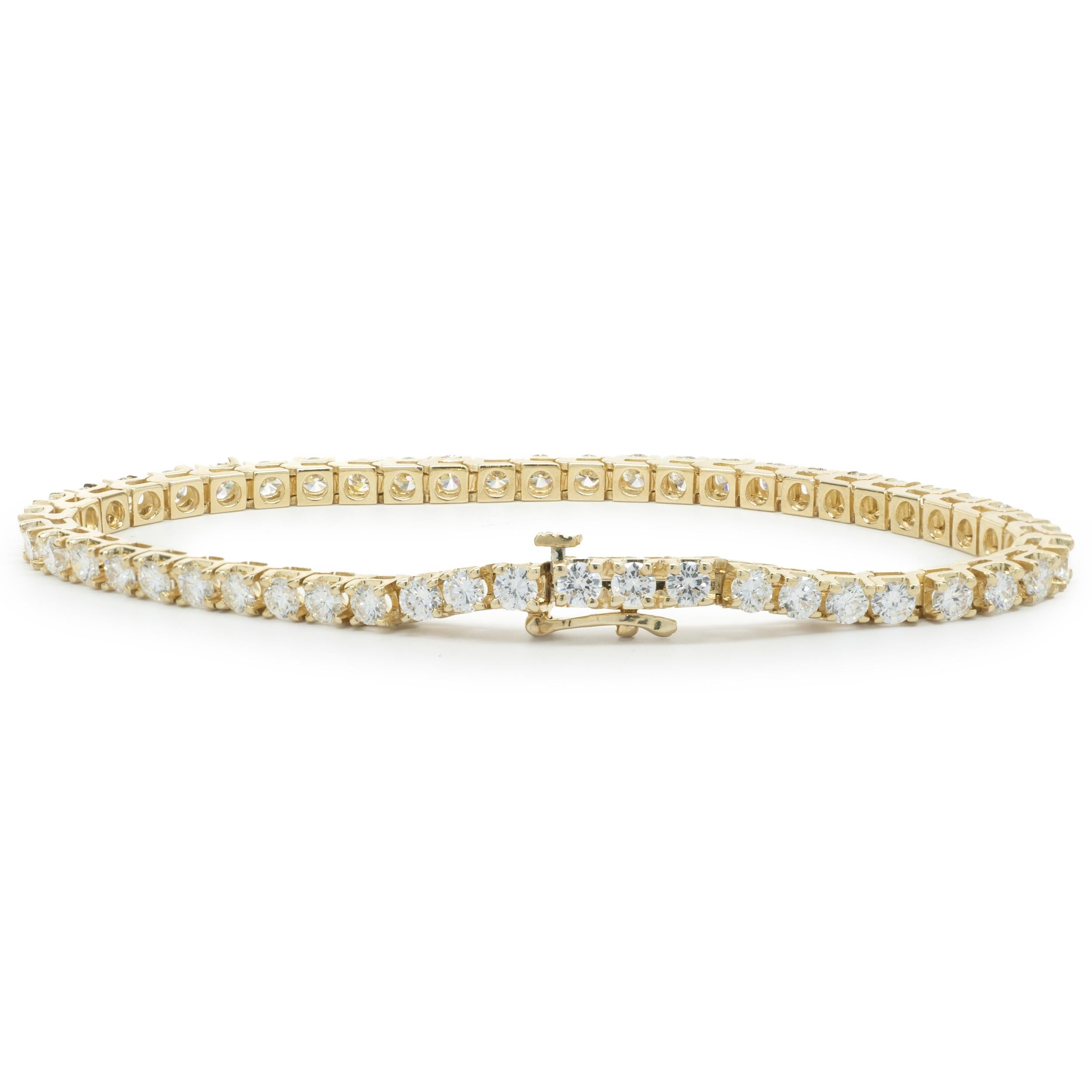 Designer: custom
Material: 14K yellow gold
Diamond: 50 round brilliant = 5.00cttw
Color: G / H
Clarity: VS2-SI1
Dimensions: bracelet will fit up to a 7-inch wrist
Weight: 12.80 grams

