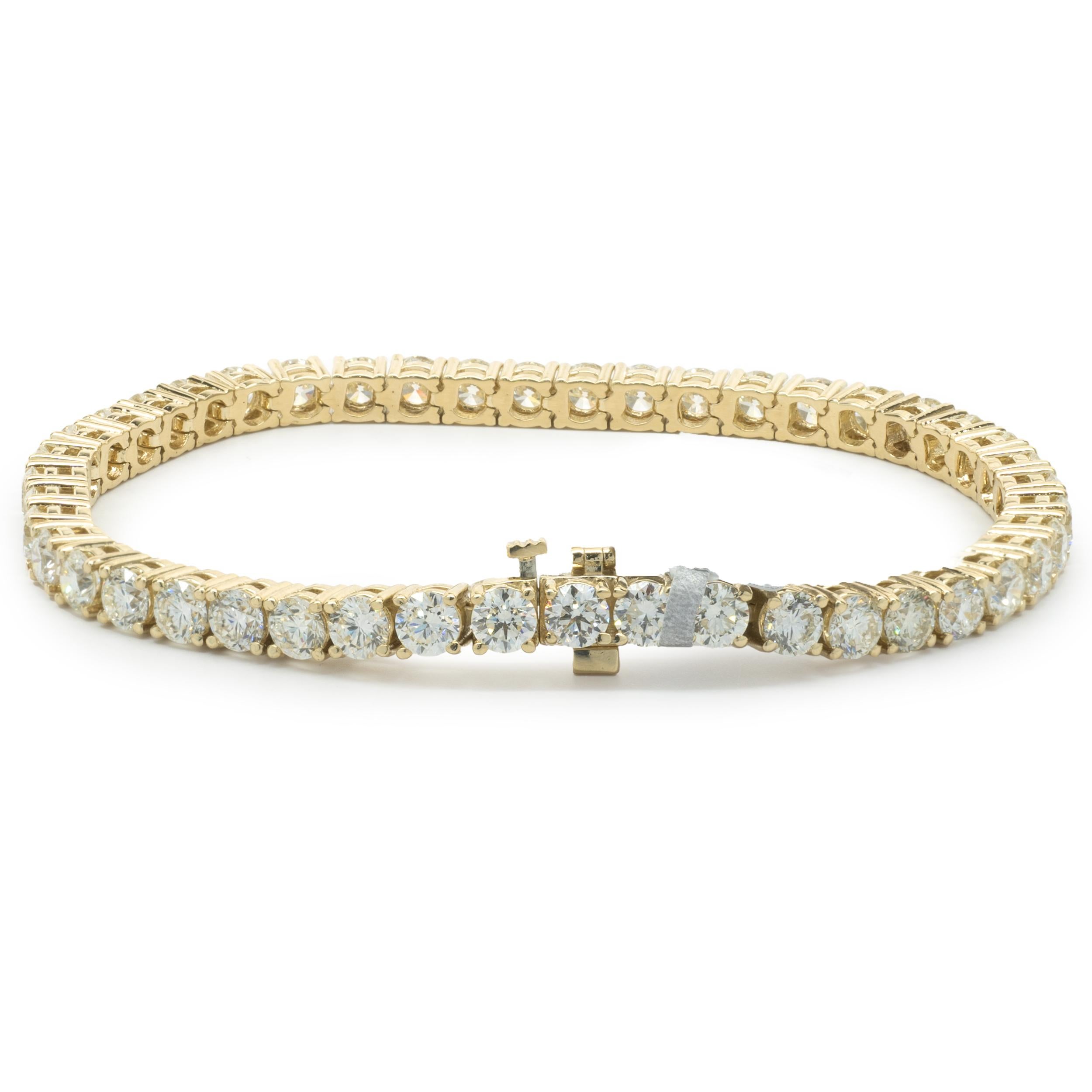 Designer: custom
Material: 14K yellow gold
Diamond: 43 round brilliant= 10.98cttw
Color: G / H
Clarity: VS2-SI1
Dimensions: bracelet will fit up to a 7-inch wrist
Weight: 15.96 grams
