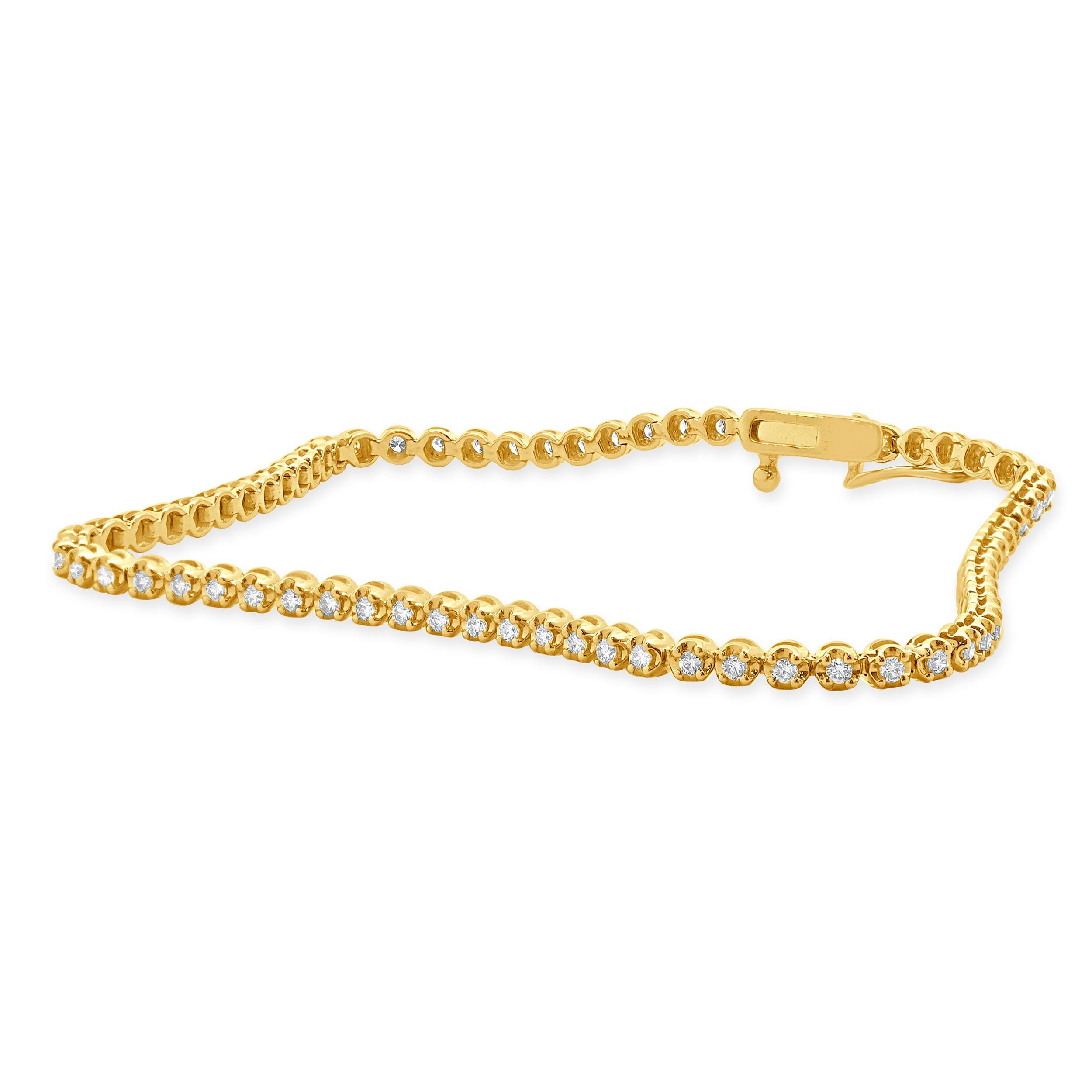 Designer: custom
Material: 14K yellow gold
Diamond: 71 round brilliant cut = 0.76cttw
Color: H
Clarity: SI1
Dimensions: bracelet will fit up to a 7-inch wrist
Weight: 4.40 grams