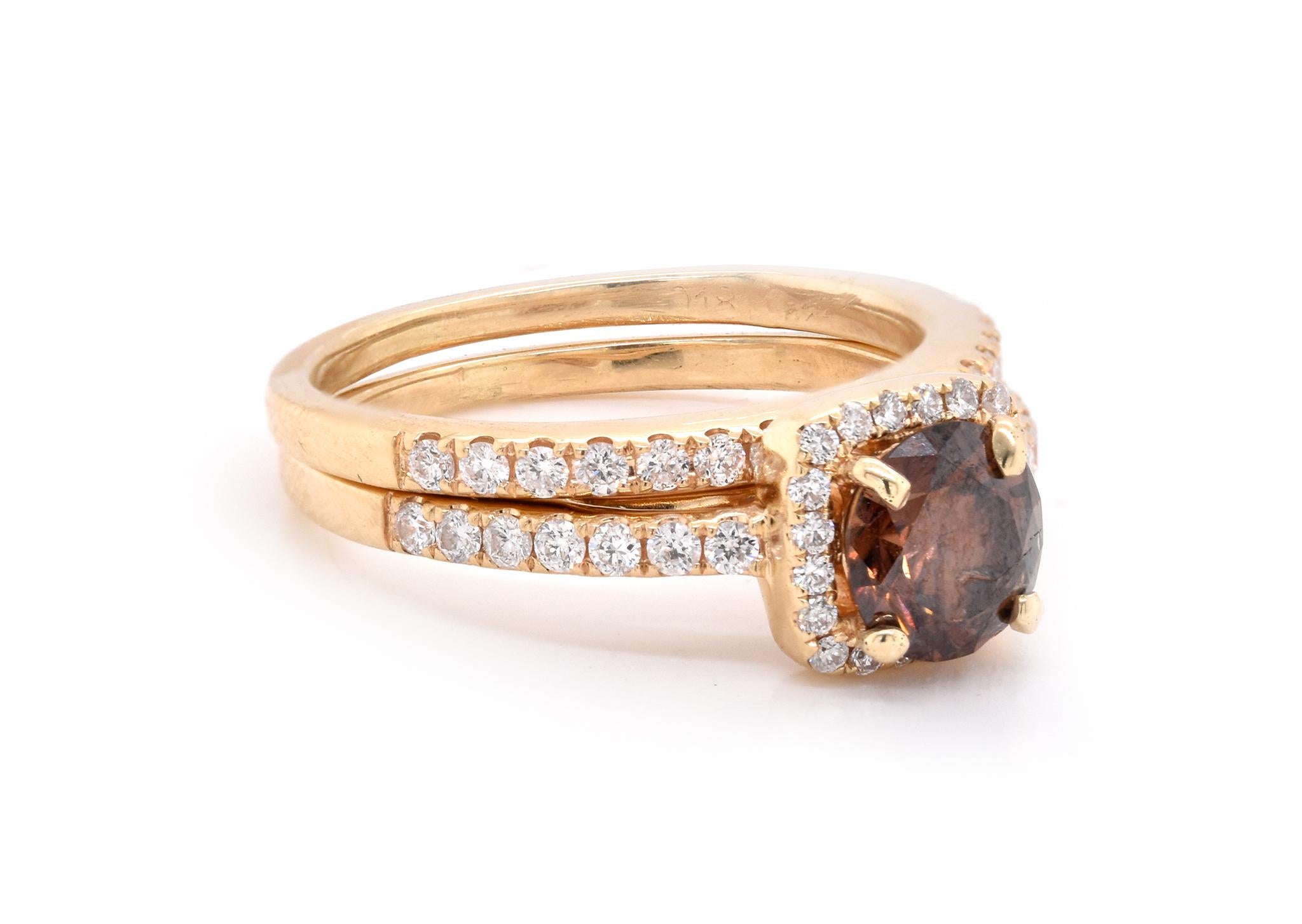 Material: 14K yellow gold
Center Diamond: 1 round brilliant cut = .90ct
Color: Chocolate
Clarity: I1
Diamonds: 31 round cut = .50cttw
Color: G
Clarity: VS2
Ring Size: 5.25 (please allow up to 2 additional business days for sizing