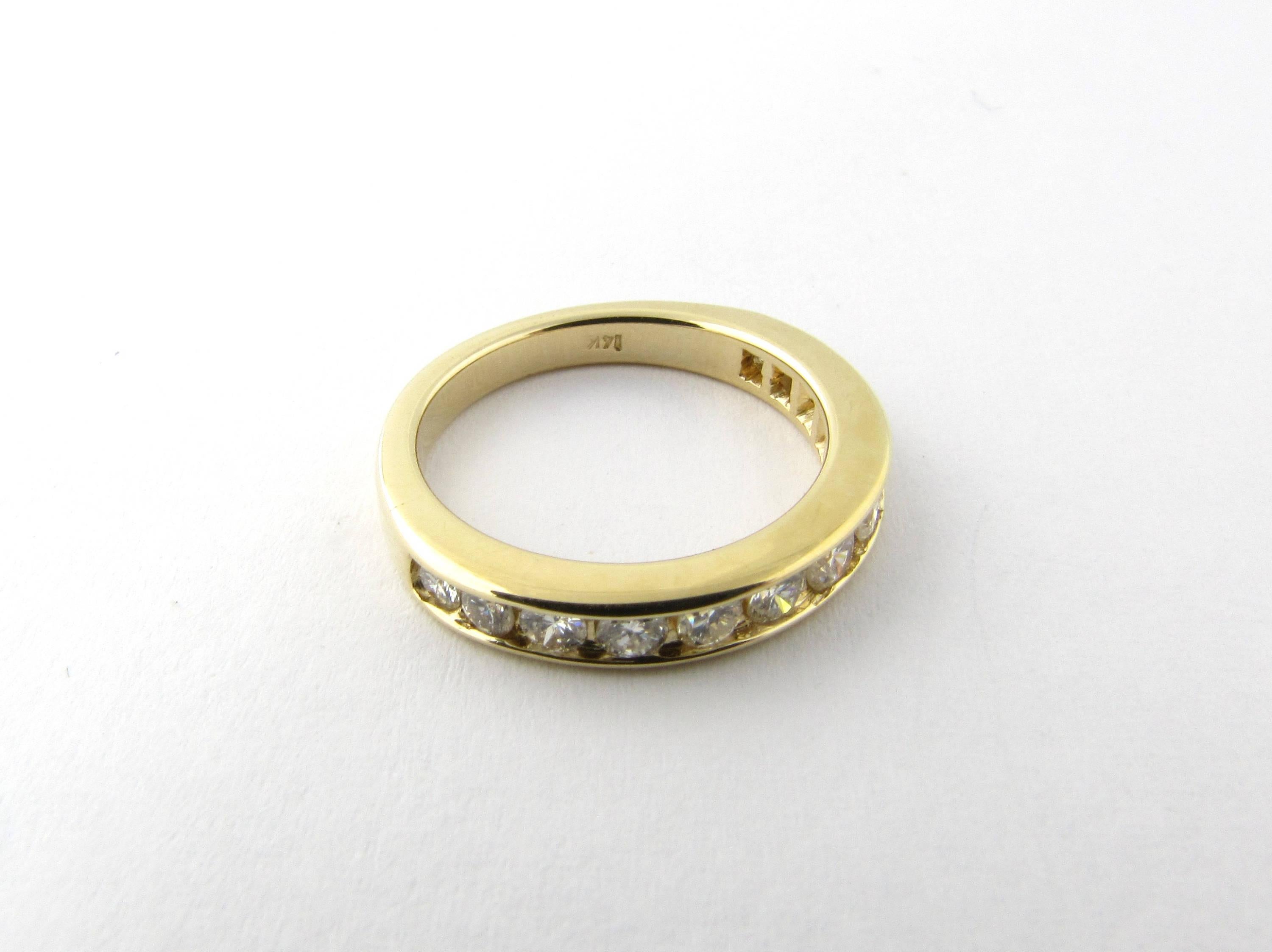 Vintage 14 Karat Yellow Gold Diamond Wedding Band Size 4.5
This sparkling wedding band features 13 round brilliant cut diamonds set in polished 14K yellow gold. 
Approximate total diamond weight: .30 ct. 
Diamond color: J 
Diamond clarity: VS2 
Ring