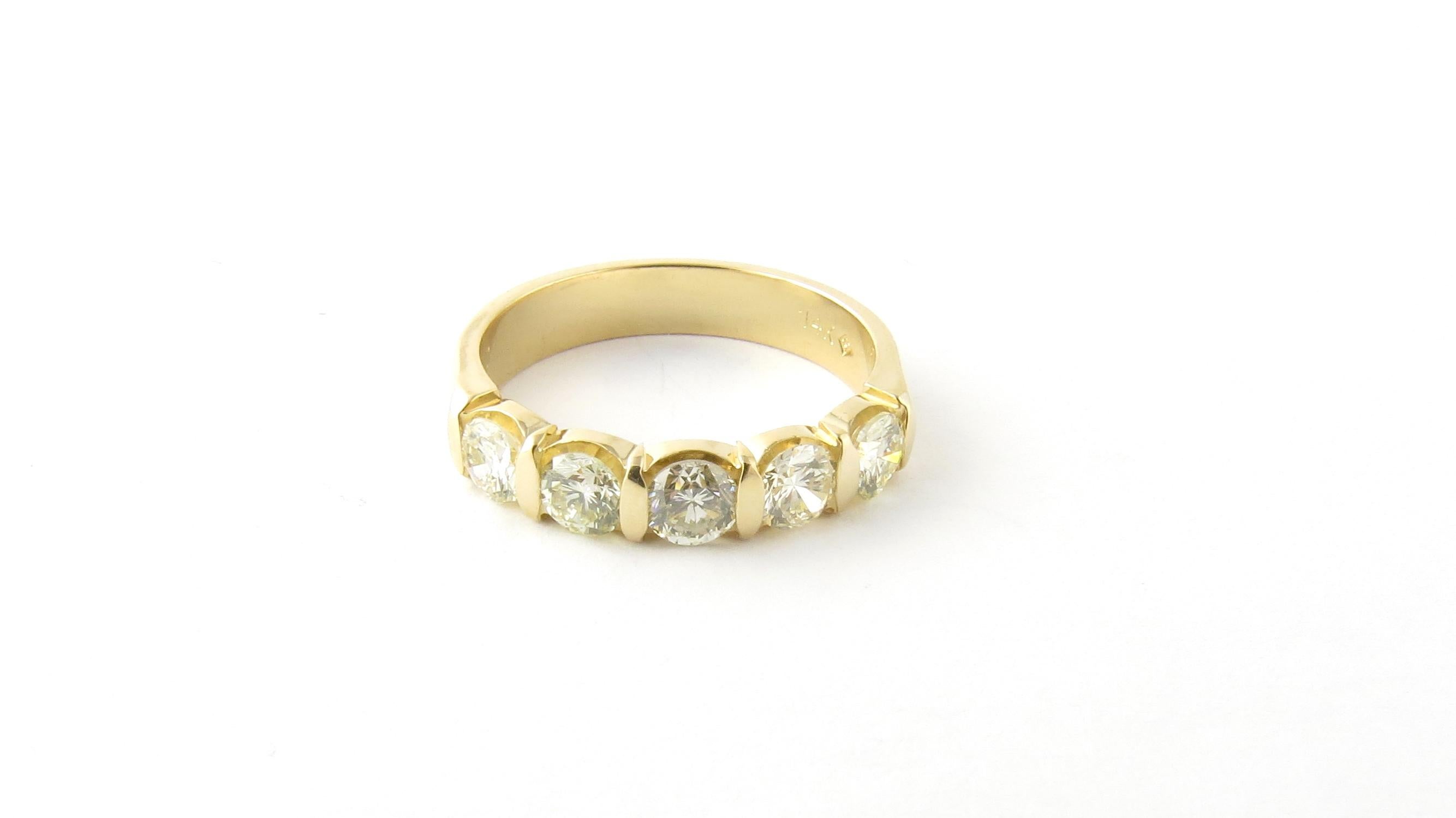 Vintage 14 Karat Yellow Gold Diamond Wedding Band Size 6

This sparkling wedding band features five round brilliant cut diamonds set in classic 14K yellow gold. Shank measures 3.5 mm.

Approximate total diamond weight: .90 ct.

Diamond color: