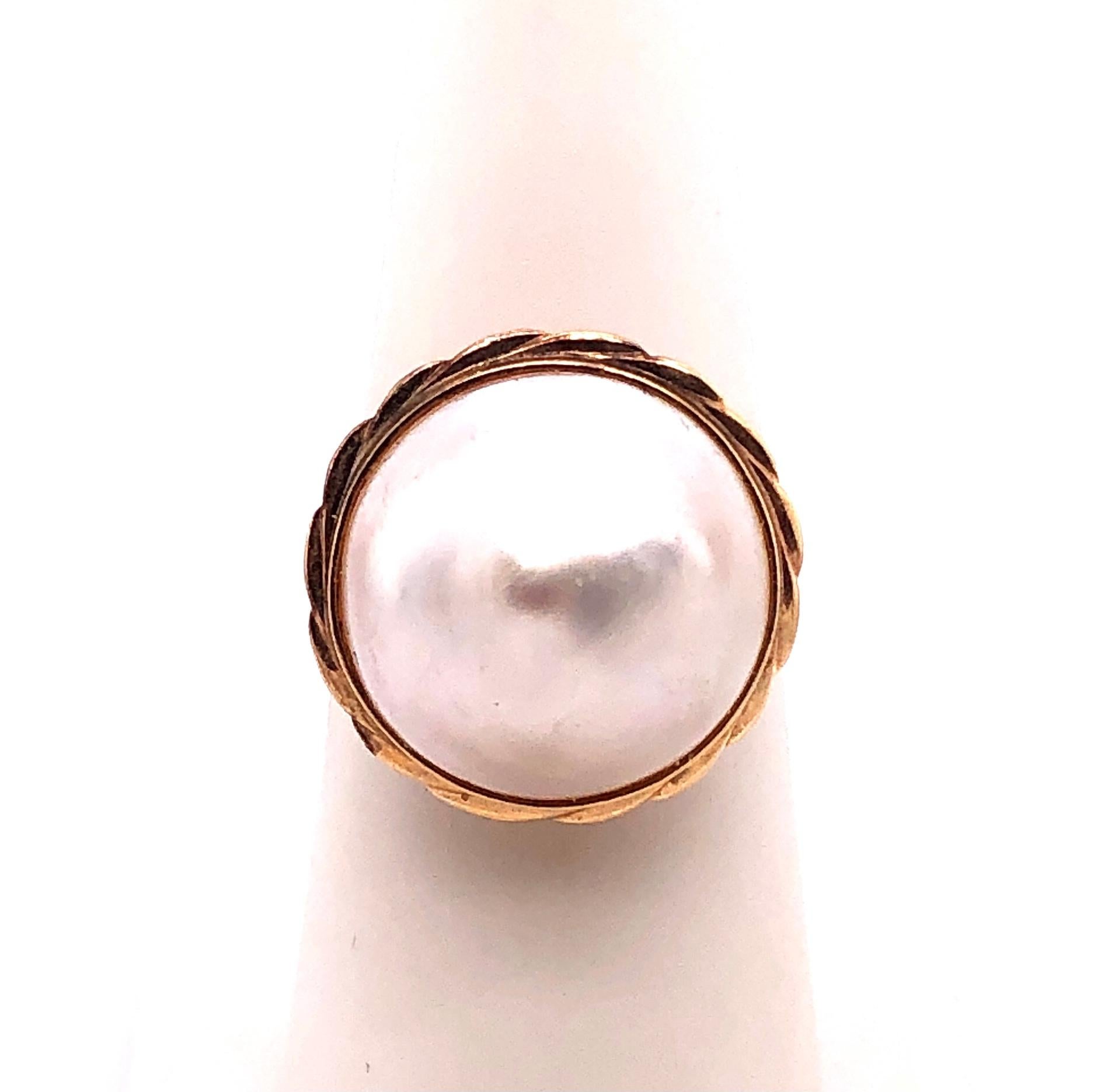 14 Karat Yellow Gold Dome Pearl Ring.
Size 6.75
4.7 grams total weight.
16.91 mm pearl size