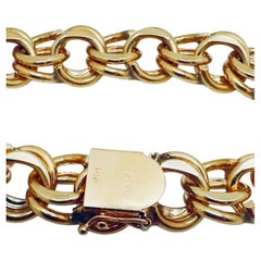 Armband aus 14-Karat-Gelbgold mit Doppelgliedern und Anhängern, 7,5 Zoll lang, 58,9 Gramm