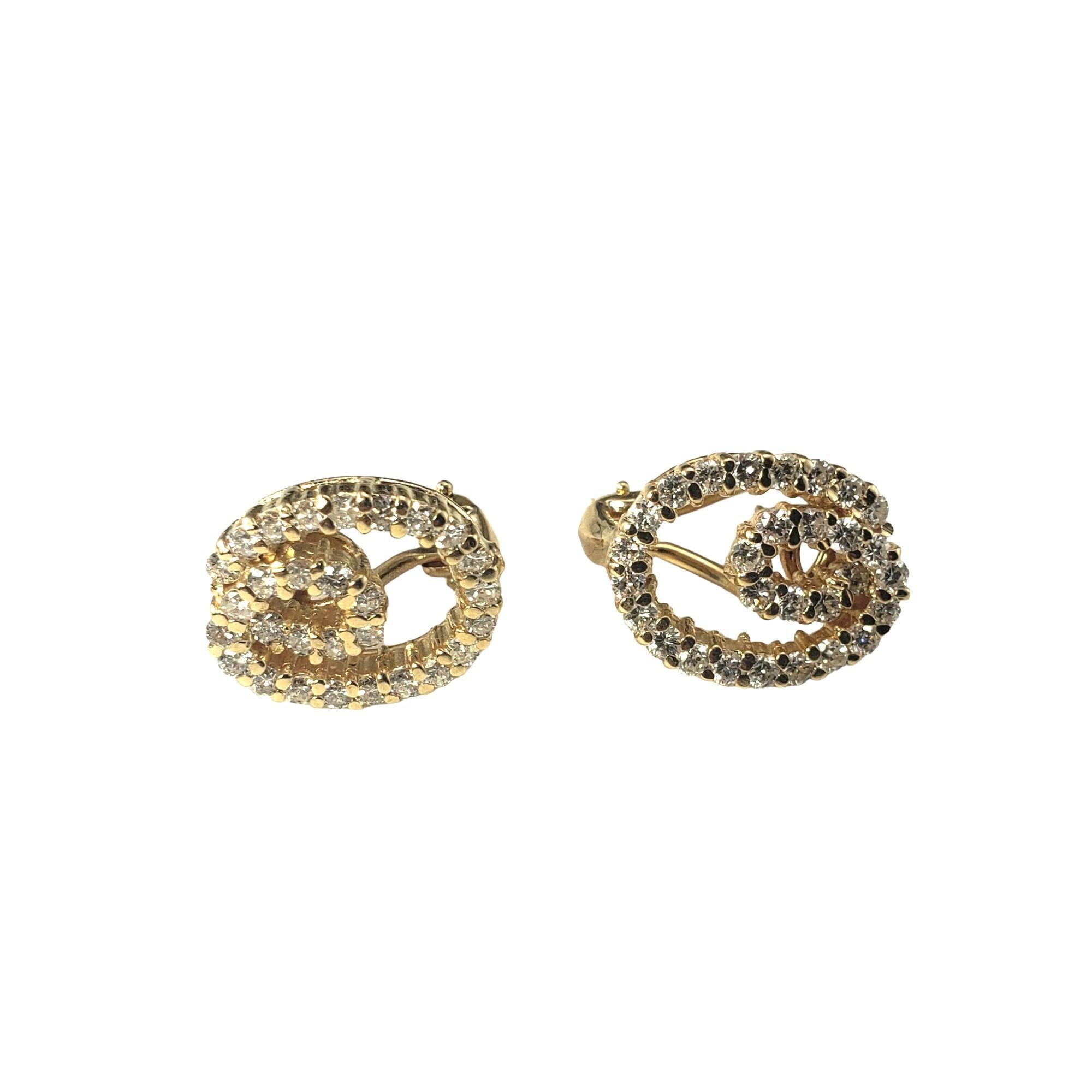 Vintage 14 Karat Yellow Gold Double Oval Diamond Earrings-

These sparkling earrings each feature 29 round brilliant cut diamonds set in classic 14K yellow gold.  Omega back closures.

Approximate total diamond weight: 1.16 ct.

Diamond color:
