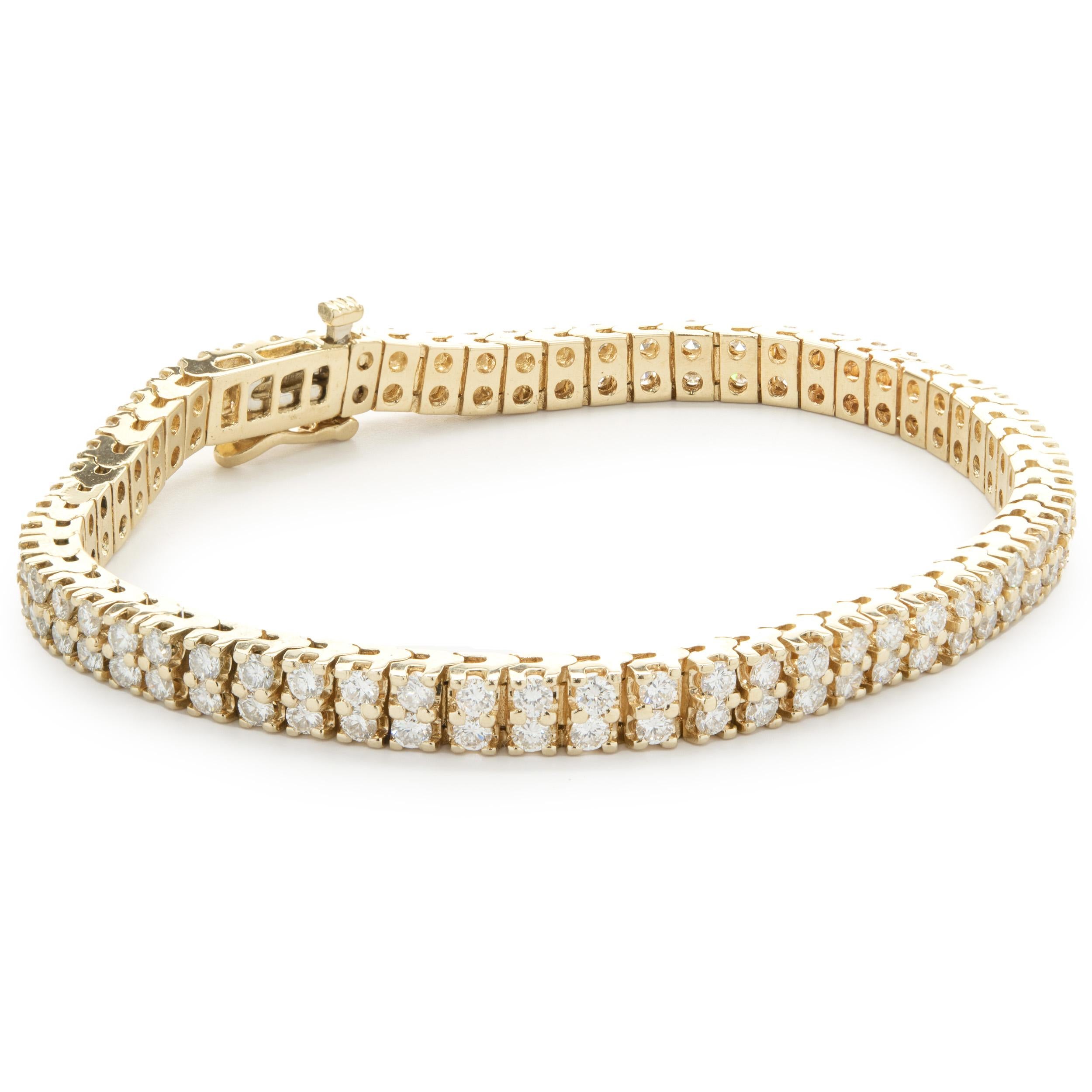 Designer: custom design
Material: 14K yellow gold
Diamonds: 222 round brilliant cut = 15.54cttw
Color: G 
Clarity: SI1
Dimensions: bracelet measures 7-inches in length 
Weight: 21.91 grams