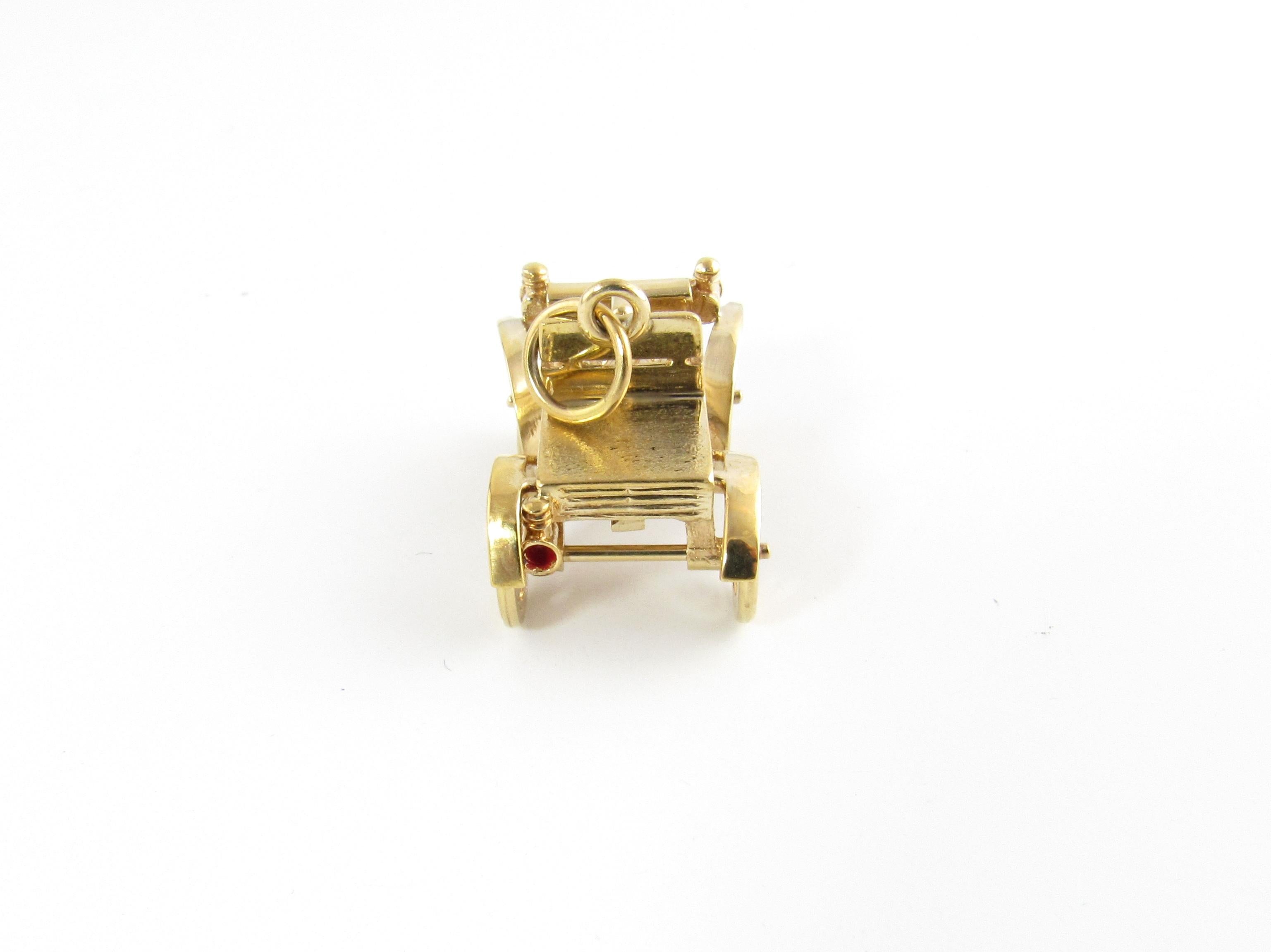 14 Karat Yellow Gold Electric Motor Car Charm-

Perfect gift for the vintage care enthusiast!

This 3D mechanical charm features an antique motor car with moving wheels and enameled headlights and brake light. Meticulously detailed in 14K yellow