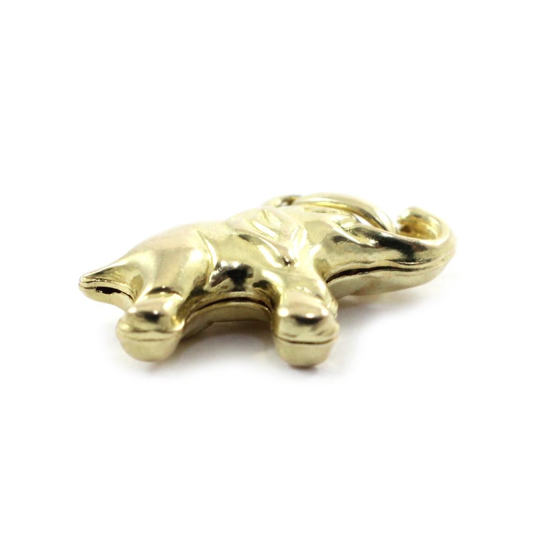 This elephant charm is made in solid 14k yellow gold. The charm measures 18x13mm, and it weighs 1.1 grams. 