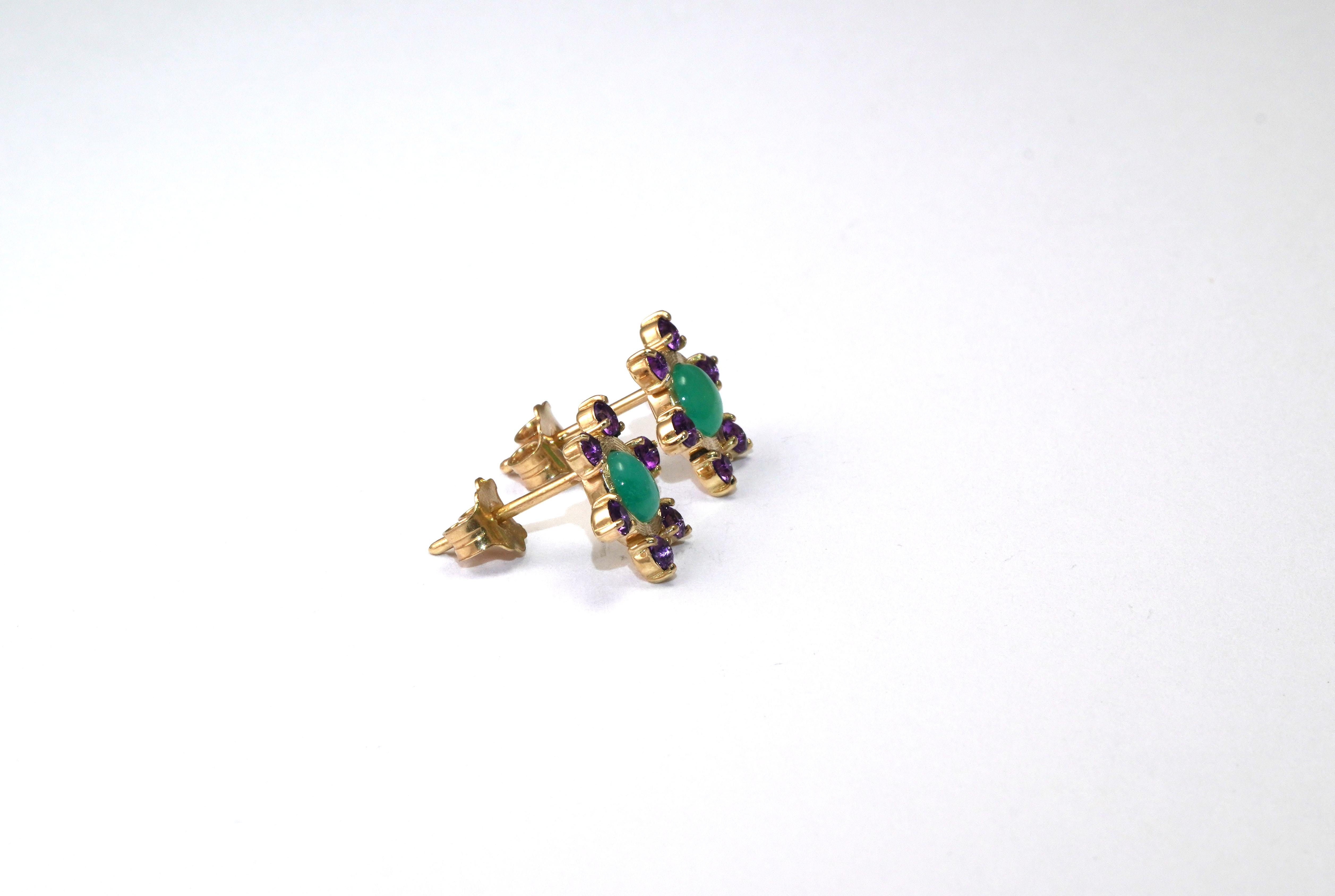 14 Karat Yellow Gold Emerald Amethyst Earrings
Gold kt: 14 
Gold color: Yellow
Total weight: 2.64 grams

Set with:
- Amethyst
Cut: Brilliant 
Color: Purple
- Columbian Emerald
Cut: Cabochon
Total weight: 1.16 carat
Color: Green