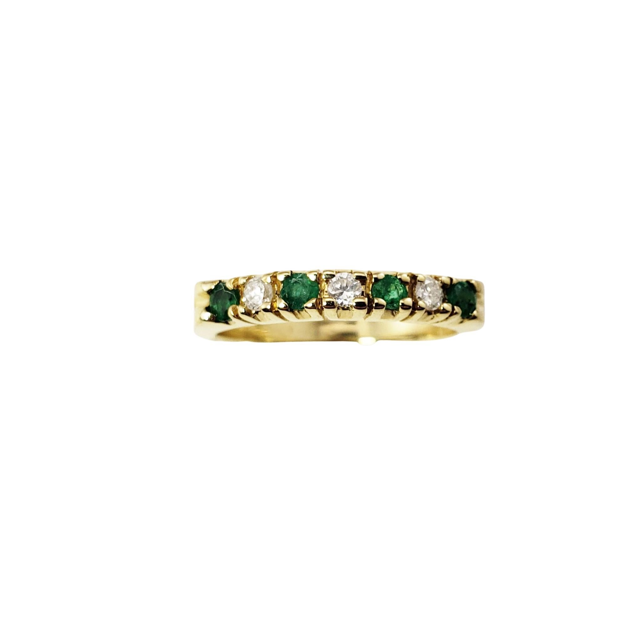 14 Karat Yellow Gold Emerald and Diamond Band Ring Size 6.5-

This lovely band features three round brilliant cut diamonds and four round emeralds set in classic 14K yellow gold.  Width:  3 mm.
Shank:  2.5 mm.

Approximate total diamond weight: .15