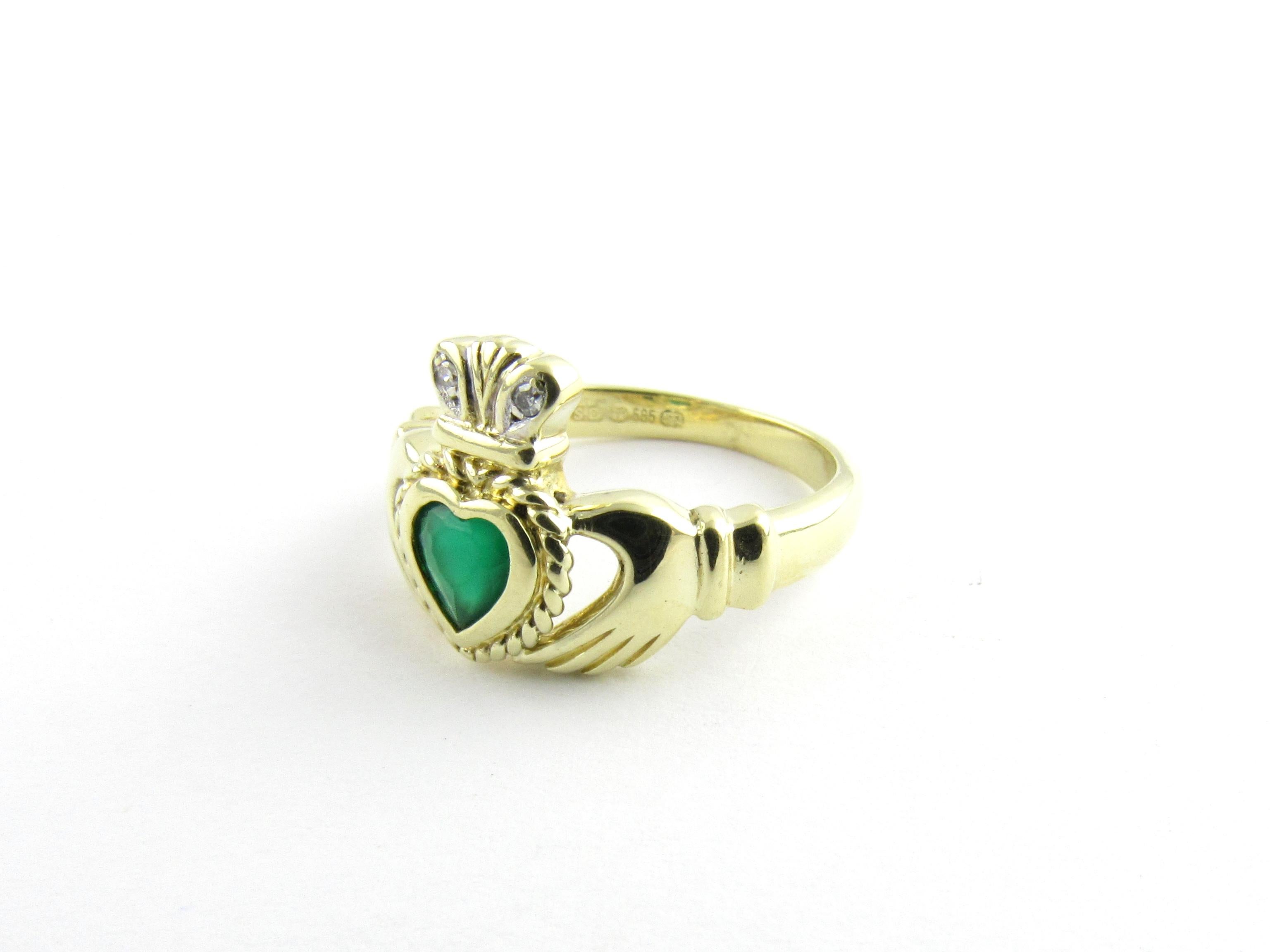 Vintage 14 Karat Yellow Gold Emerald and Diamond Claddagh Ring Size 6

The traditional Irish Claddagh Ring is a symbol of friendship, loyalty and love.

Decorated with one heart shaped emerald and two round single cut diamonds and crafted in