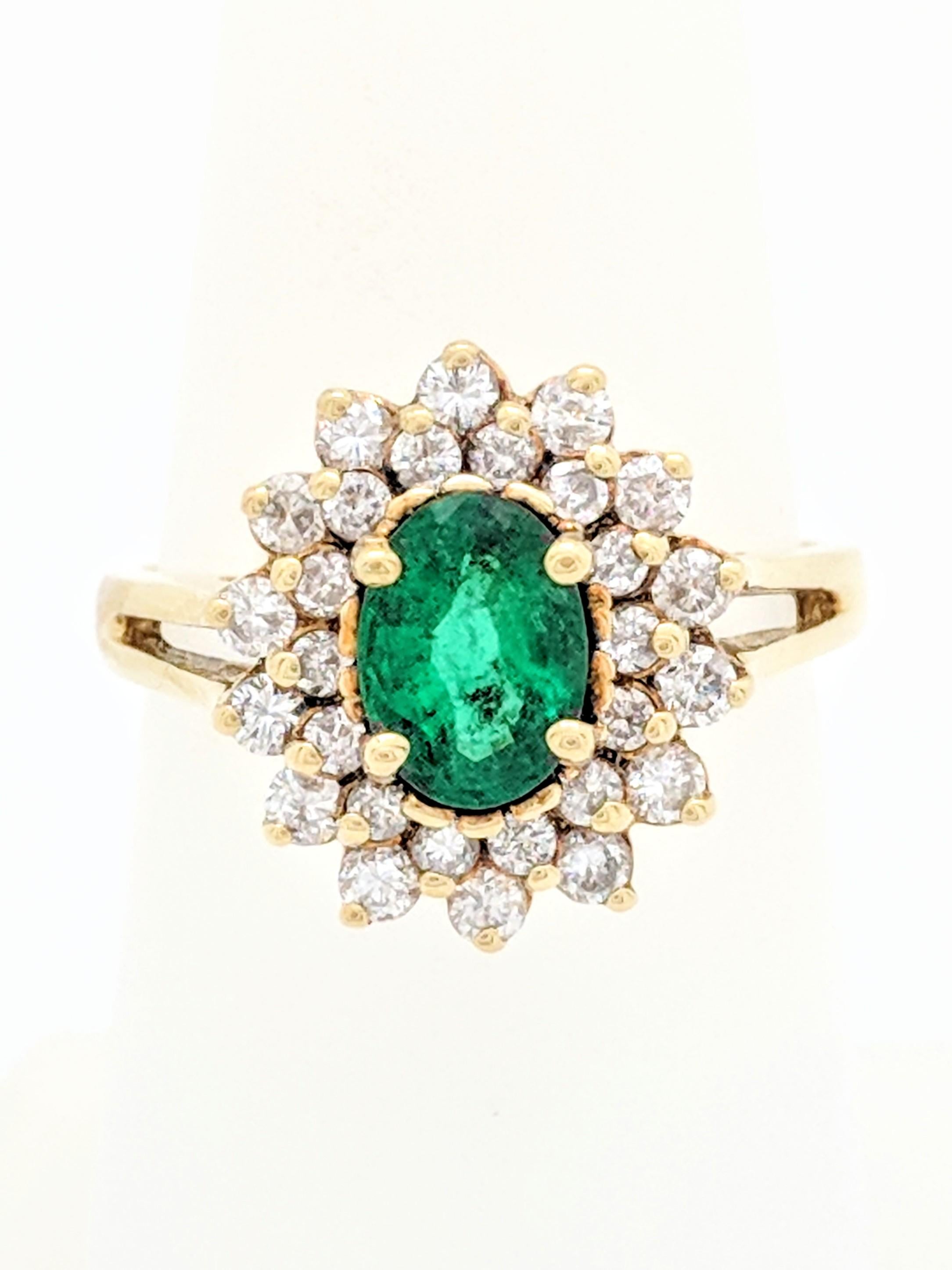 You are viewing a gorgeous natural oval emerald set in a beautiful diamond setting. The setting is crafted from 18k yellow gold and features .50ctw of natural round brilliant cut diamonds. These diamonds are estimated to be SI1 in clarity and G