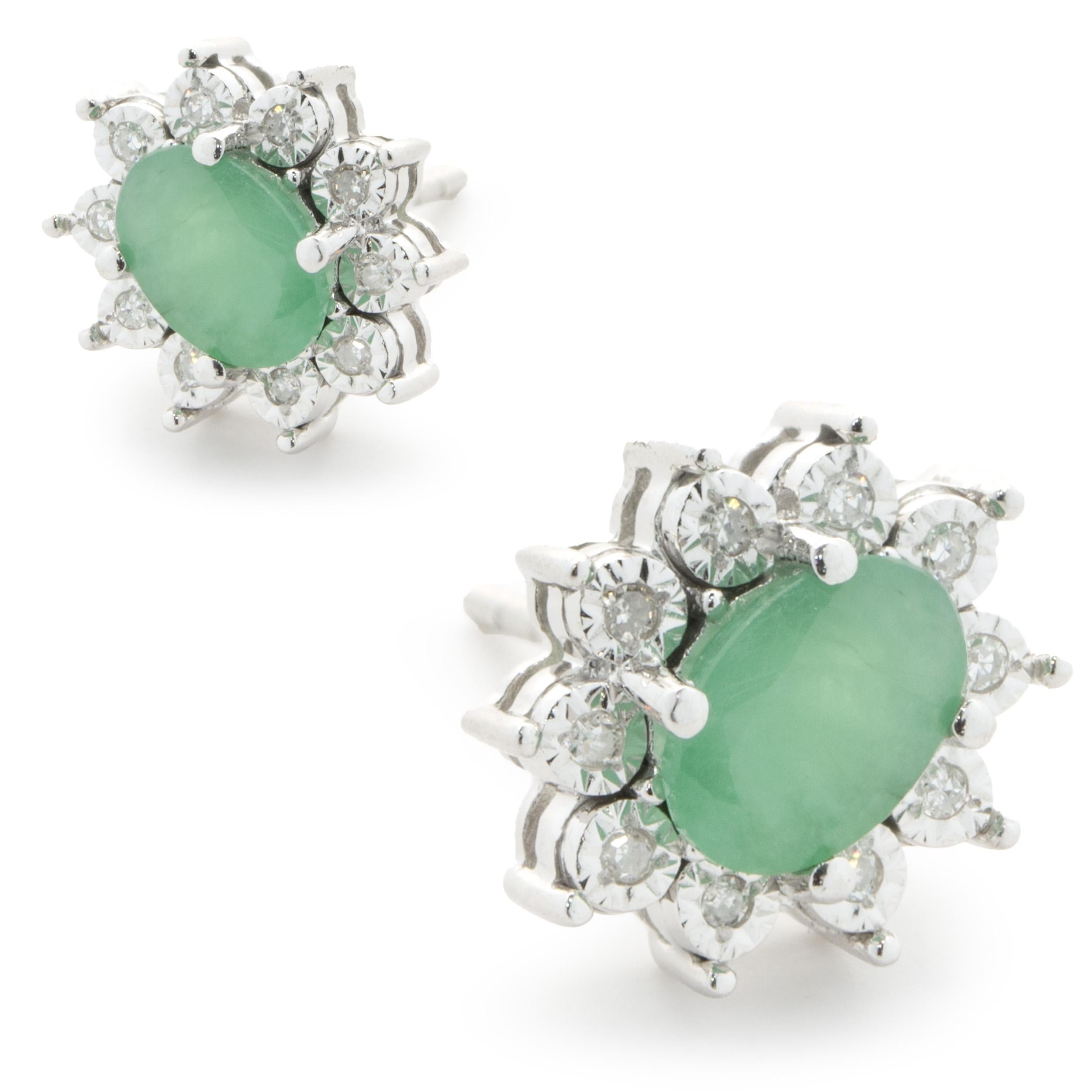 Oval Cut 14 Karat White Gold Emerald and Diamond Halo Stud Earrings