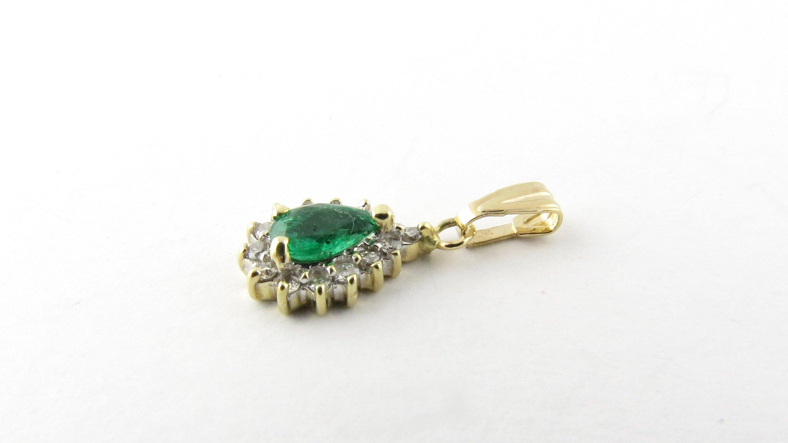 Vintage 14 Karat Yellow Gold Emerald and Diamond Pendant
This stunning pendant features one pear shaped emerald (7 mm x 4 mm) surrounded by 14 round brilliant cut diamonds set in 14K yellow gold. 
Approximate total diamond weight: .14 ct. 
Diamond