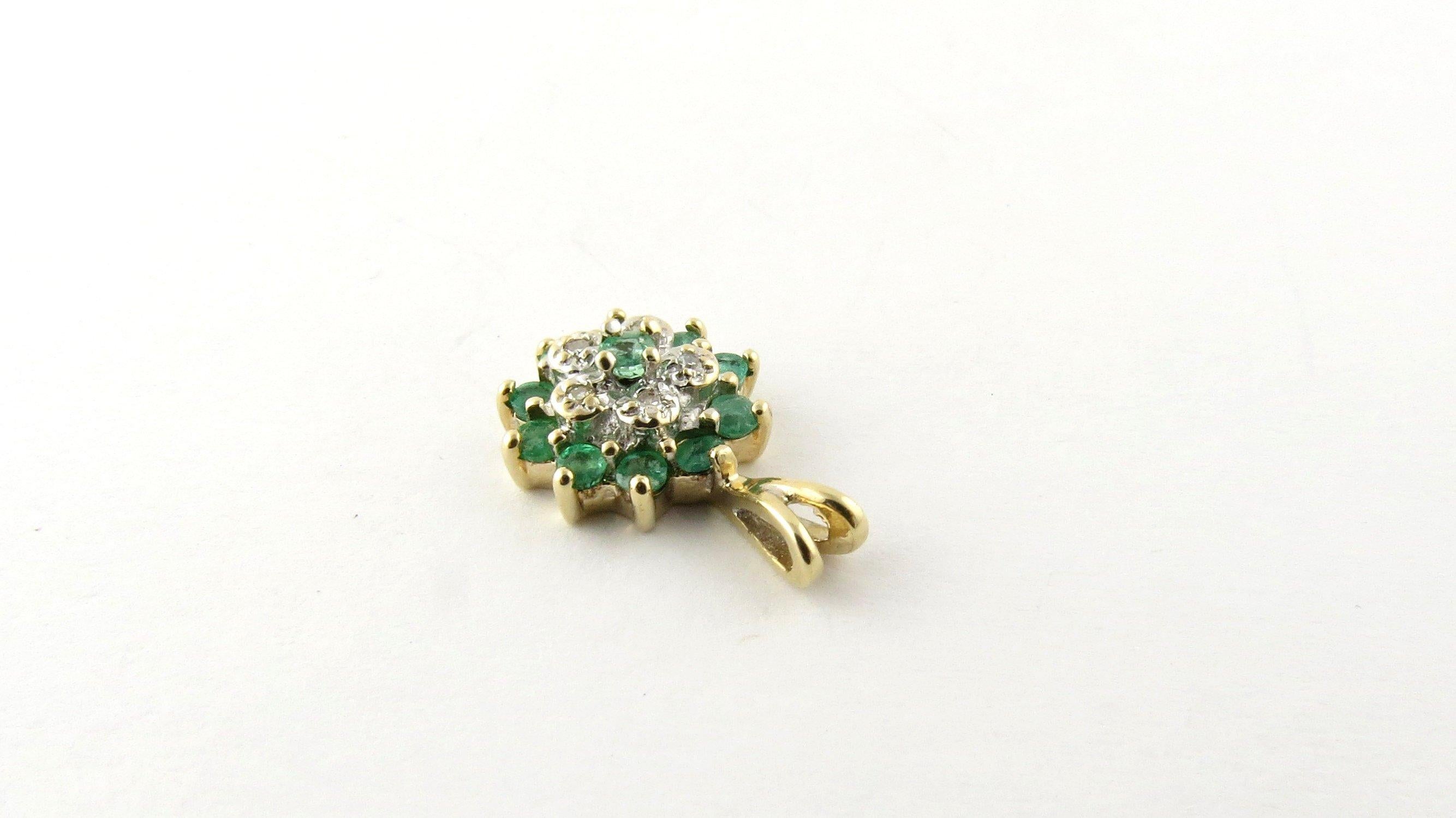 Vintage 14 Karat Yellow Gold Emerald and Diamond Pendant- This stunning pendant features 11 round emeralds and five round single cut diamonds set in classic 14K yellow gold. Approximate total diamond weight: .025 ct. Diamond color: J Diamond