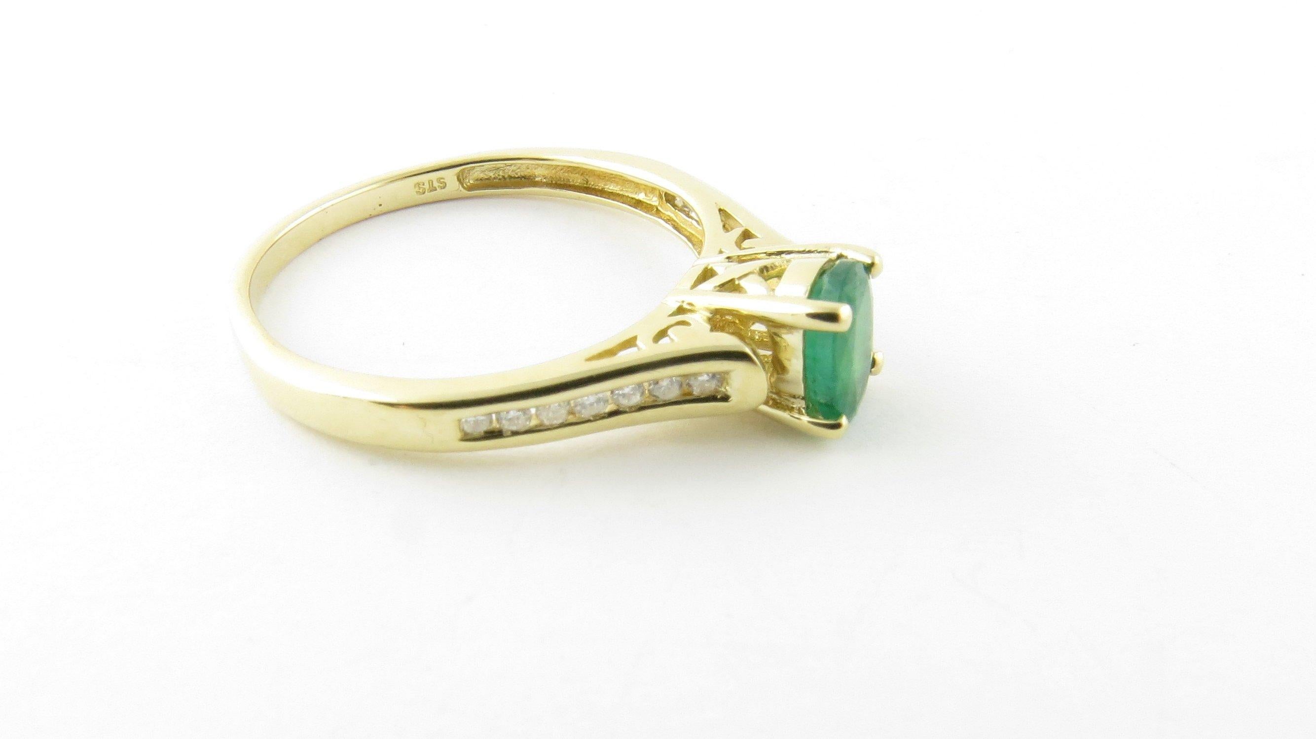 Round Cut 14 Karat Yellow Gold Emerald and Diamond Ring