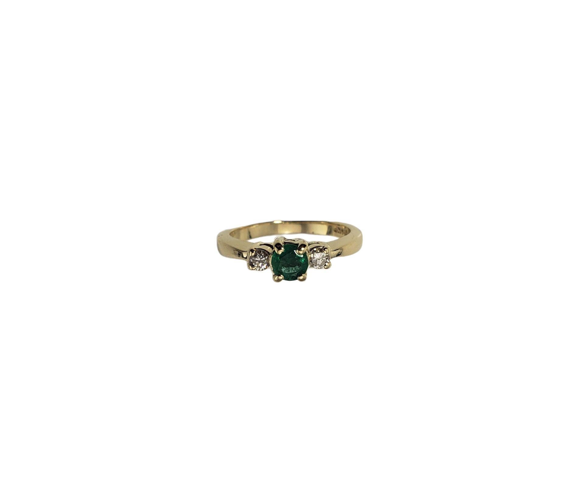 Vintage 14 Karat Yellow Gold Emerald and Diamond Ring Size 5.25-

This lovely ring features one round emerald (5 mm) and two round brilliant cut diamonds set in 14K yellow gold. Shank: 2 mm.

Approximate total diamond weight: .12 ct.

Diamond