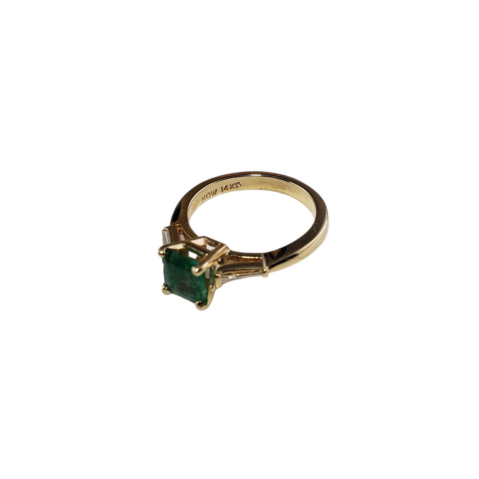 Vintage 14 Karat Yellow Gold Emerald and Diamond Ring Size 6 JAGi Certified-

This elegant ring features one square cut emerald and two baguette diamonds set in classic 14K yellow gold. Width: 6 mm. Shank: 2 mm.

Total emerald weight: .76 ct.

Total
