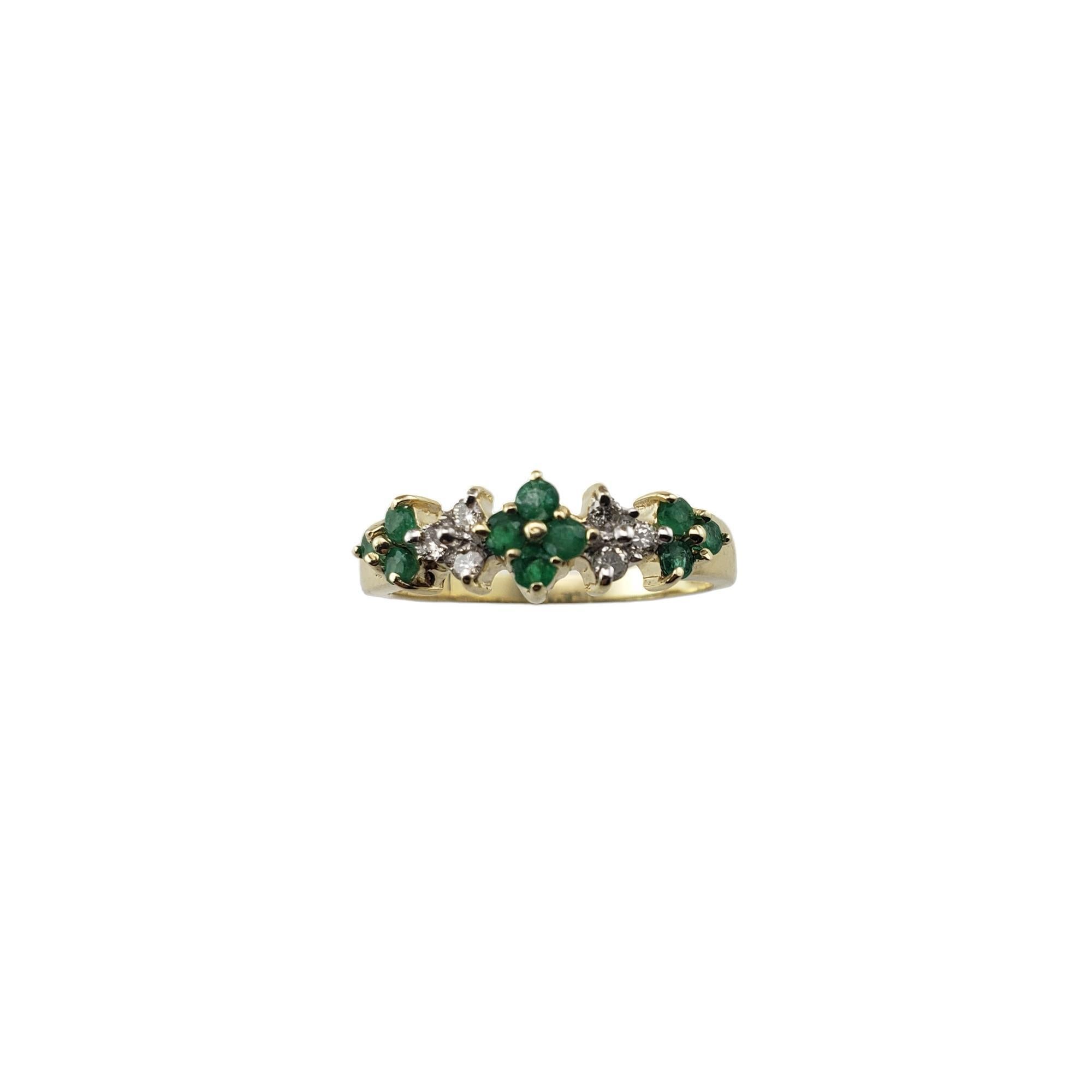 Vintage 14 Karat Yellow Gold Emerald and Diamond Ring Size 7-

This elegant ring features ten round emeralds and six round brilliant cut diamonds set in classic 14K yellow gold.  Width:  6 mm.  Shank: 1.9 mm.

Approximate total diamond weight:   .12