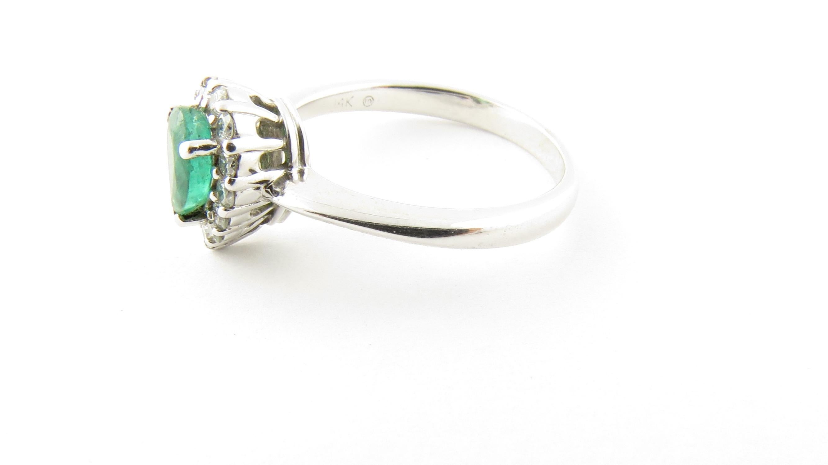 Vintage 14 Karat White Gold Emerald and Diamond Ring Size 7.25

This stunning ring features one pear-shaped genuine emerald (7 mm x 5 mm) surrounded by 13 round brilliant cut diamonds and set in classic 14K white gold. Shank measures 2 mm. 
*Emerald