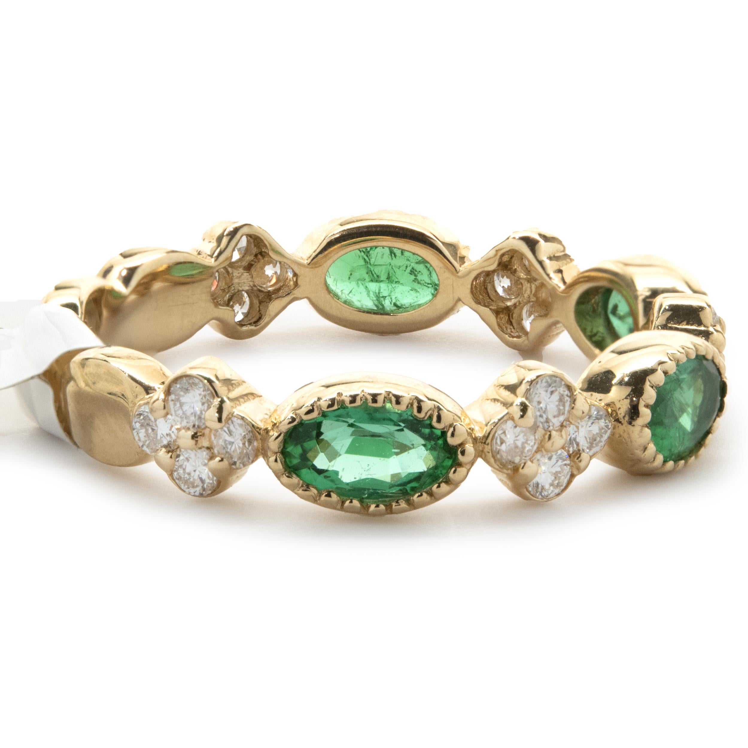 Designer: custom design
Material: 14K yellow gold
Emerald: 4 oval cut = .91cttw
Diamond: 20 round brilliant cut = .30cttw
Color: G
Clarity: SI1
Dimensions: band measures 4.10mm wide
Ring Size: 7 (complimentary sizing available)
Weight: 3.11 grams

