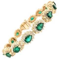 14 Karat Yellow Gold Emerald and Diamond Tennis Bracelet