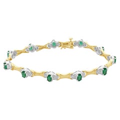 14 Karat Yellow Gold Emerald and Diamond Tennis Bracelet