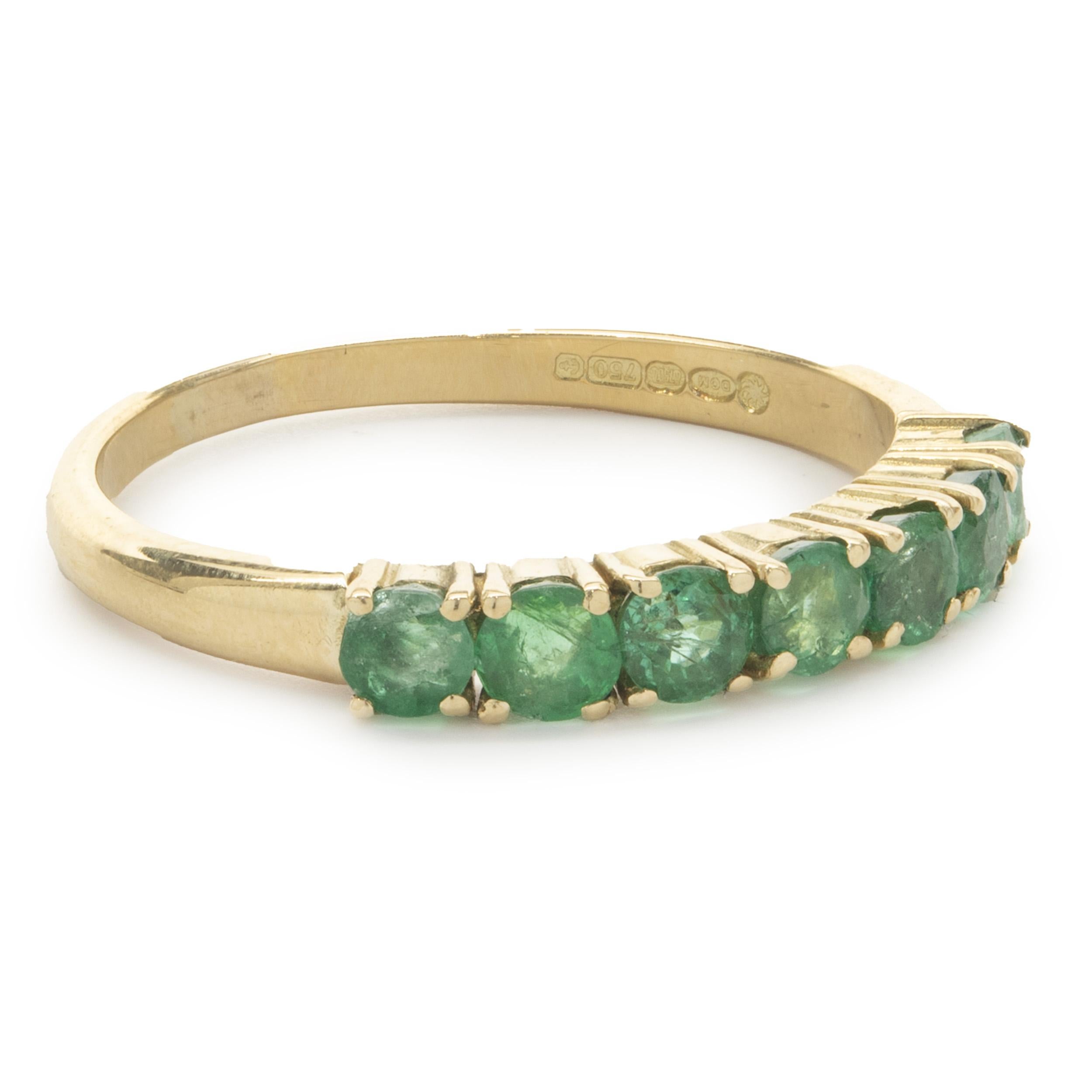 Designer: custom
Material: 14K yellow gold
Emerald: 7 round cut = 1.40cttw
Dimensions: ring top measures 3.32mm wide
Ring Size: 8.75 (complimentary sizing available)
Weight: 3.19 grams