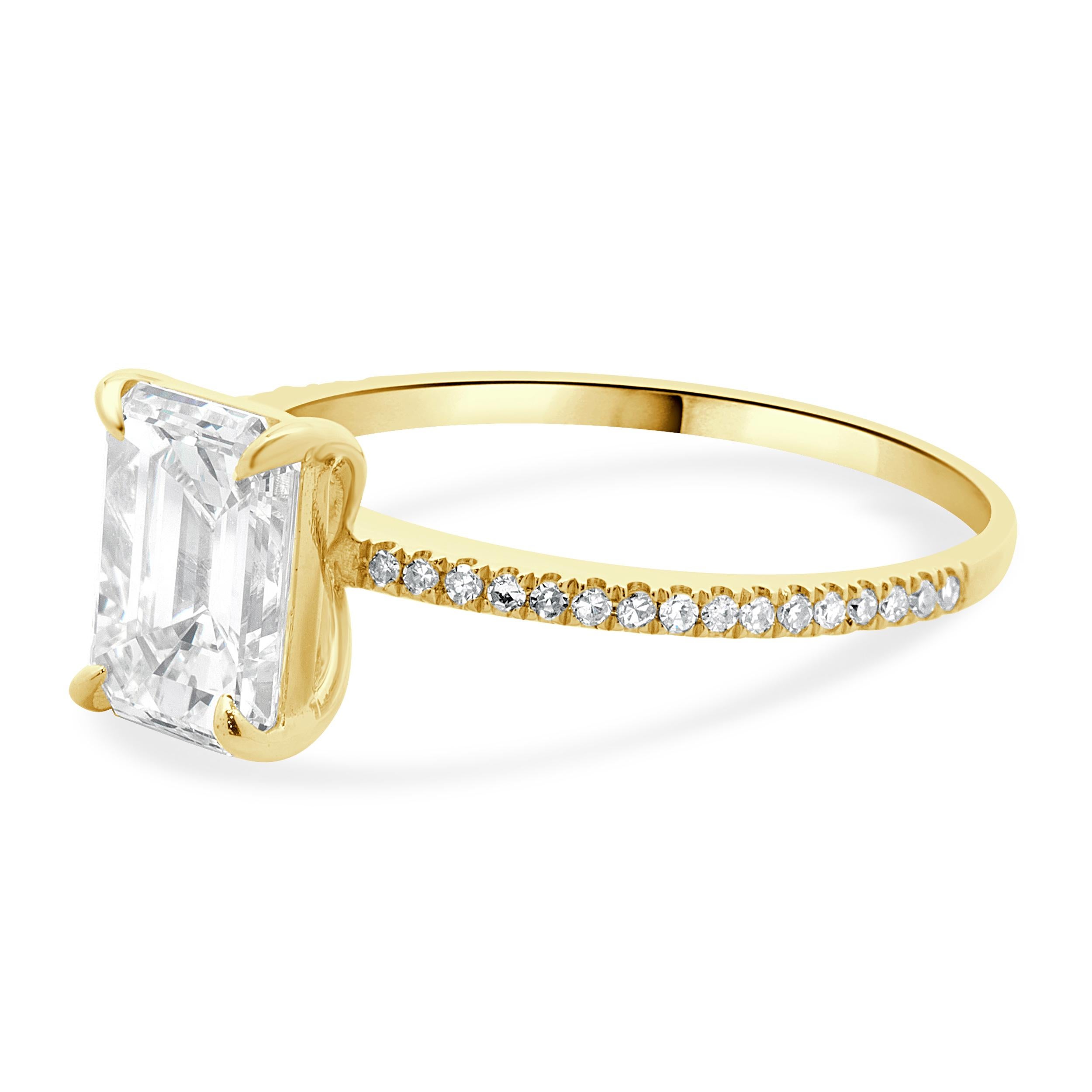 Designer: custom
Material: 14K yellow gold
Diamond: 1 emerald cut = 1.82ct
Color: J
Clarity: VS2
GIA: 6224995343
Diamond: 32 round brilliant cut = 0.16cttw
Color: H
Clarity: SI1
Dimensions: ring top measures 8.5mm wide
Ring Size: 6.5 (complimentary