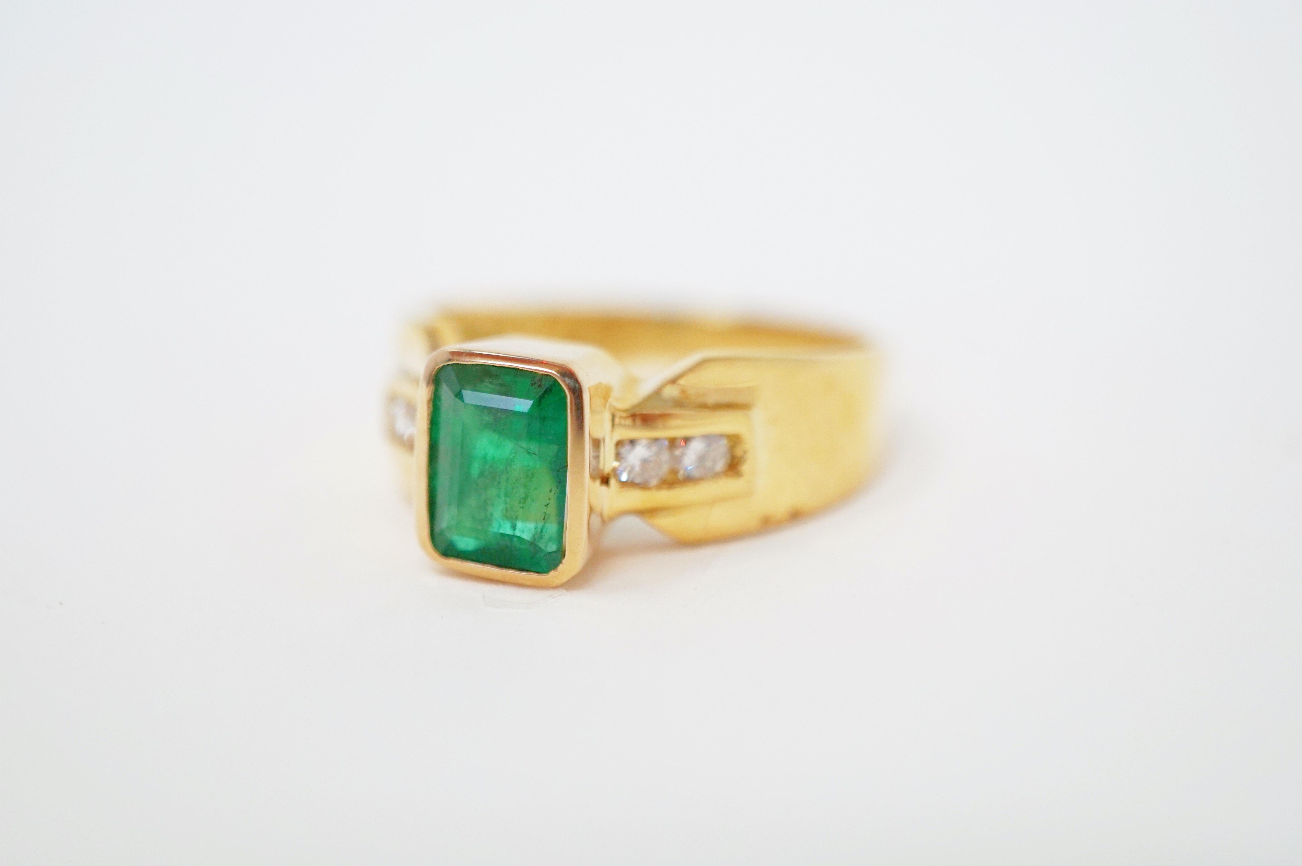 Brilliant & Vivid Emerald Ring in 14k Yellow Gold with Diamond Accents.

Features one emerald-cut emerald weighing approximately 1.00 ct., flanked by four full-cut diamonds weighing a total of approximately 0.20 cttw., set in a 14k yellow gold