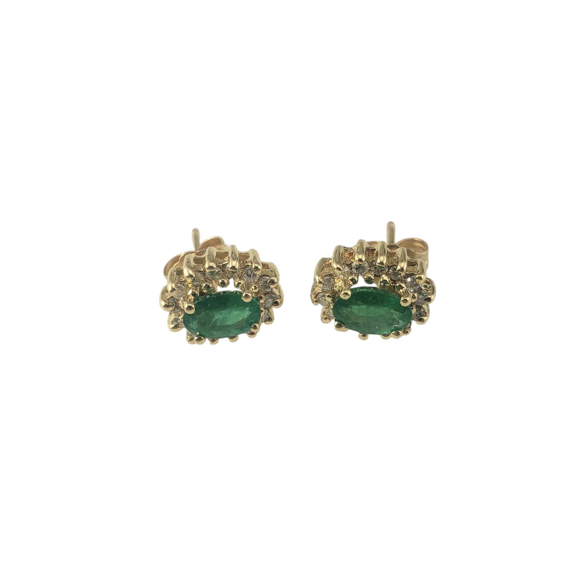 14 Karat Yellow Gold Emerald and Diamond Stud Earrings JAGi Certified-

These elegant earrings each feature one oval emerald (6.1 mm x 4.1 mm) surrounded by 14 round brilliant cut diamonds set in 14K yellow gold. Push back closures.

Approximate