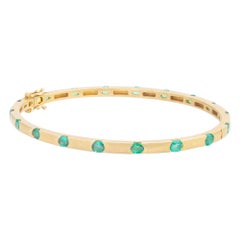 14 Karat Yellow Gold & Emerald Hinged Bangle