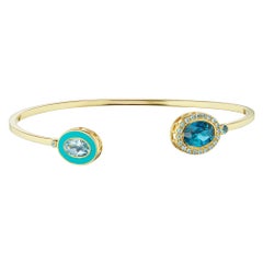 14 Karat Yellow Gold, Enamel, Blue and White Topaz Cuff Bracelet