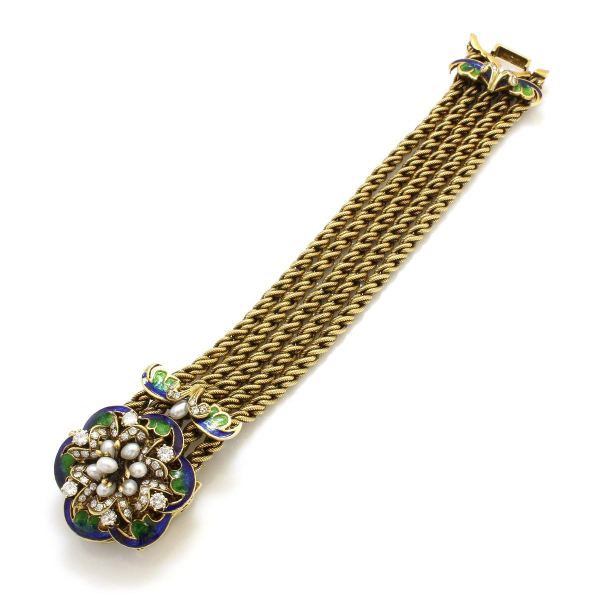 14K Yellow Gold Enameled Diamond and Pearl Antique Floral Bracelet
Metal: 14 K Yellow Gold
Length: 6.5 Inches
Width: 1 Inch
Gram Weight: 83.9 Grams
Diamond Cut: Round
Diamond Clarity: VS1-VS2
Diamond Color: H-I
Diamond Weight: 1.5 CT
Gemstone Cut: