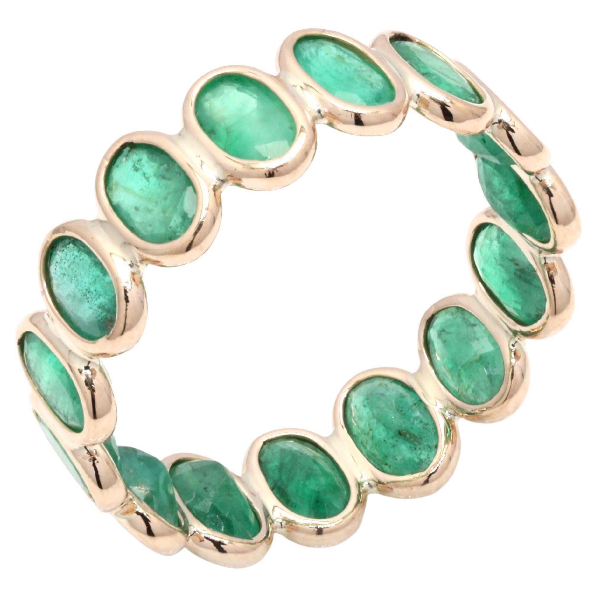 For Sale:  14 Karat Yellow Gold Eternity Ring with 3.41 Ct Oval Cut Natural Emerald