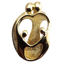 14 Karat Yellow Gold Family Of Four Embracing Pendant #23936