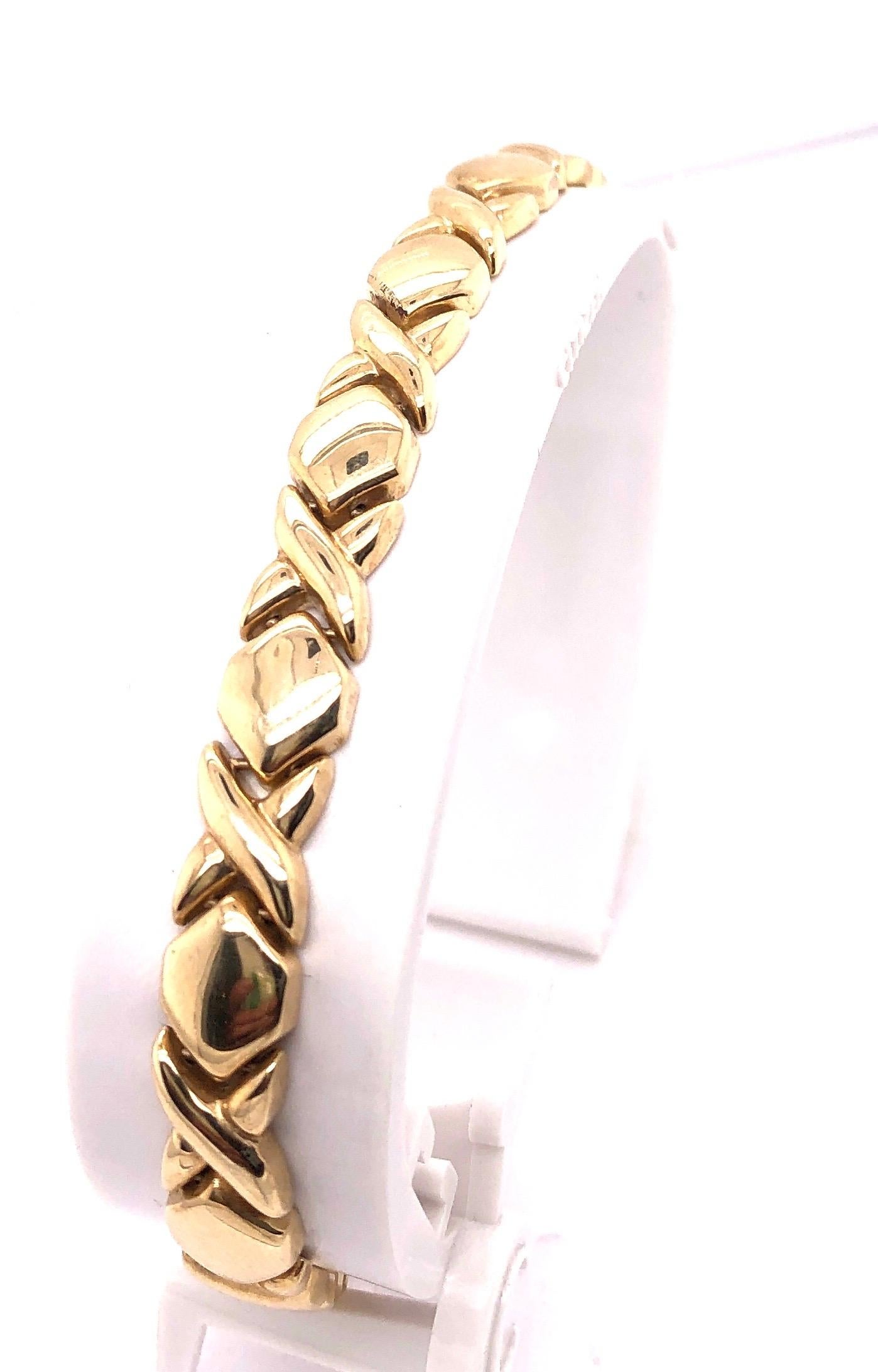 14 Karat Yellow Gold Fancy Link 7 inch Bracelet .
7mm wide
11 grams total weight.