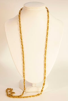 Collana A Link in oro giallo 14 carati con bottoni stilizzati e motivi Looping